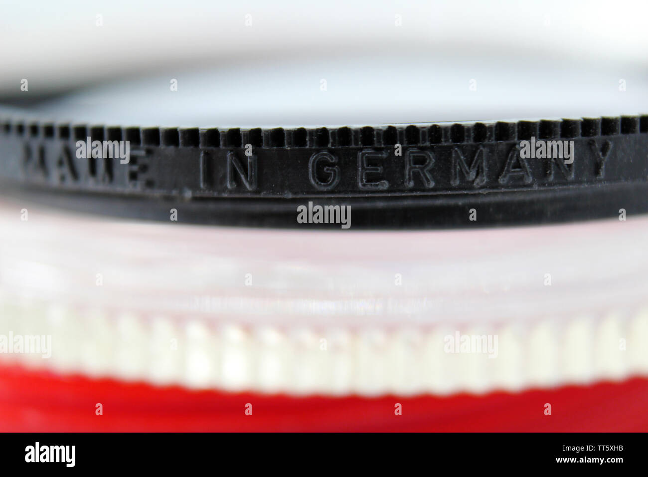 Macro shot of photography uv lens protector made in germany inscription, isolated on white background, close-up Stock Photo