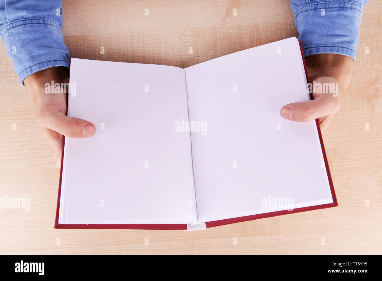 Hands holding an open empty book background Stock Photo by
