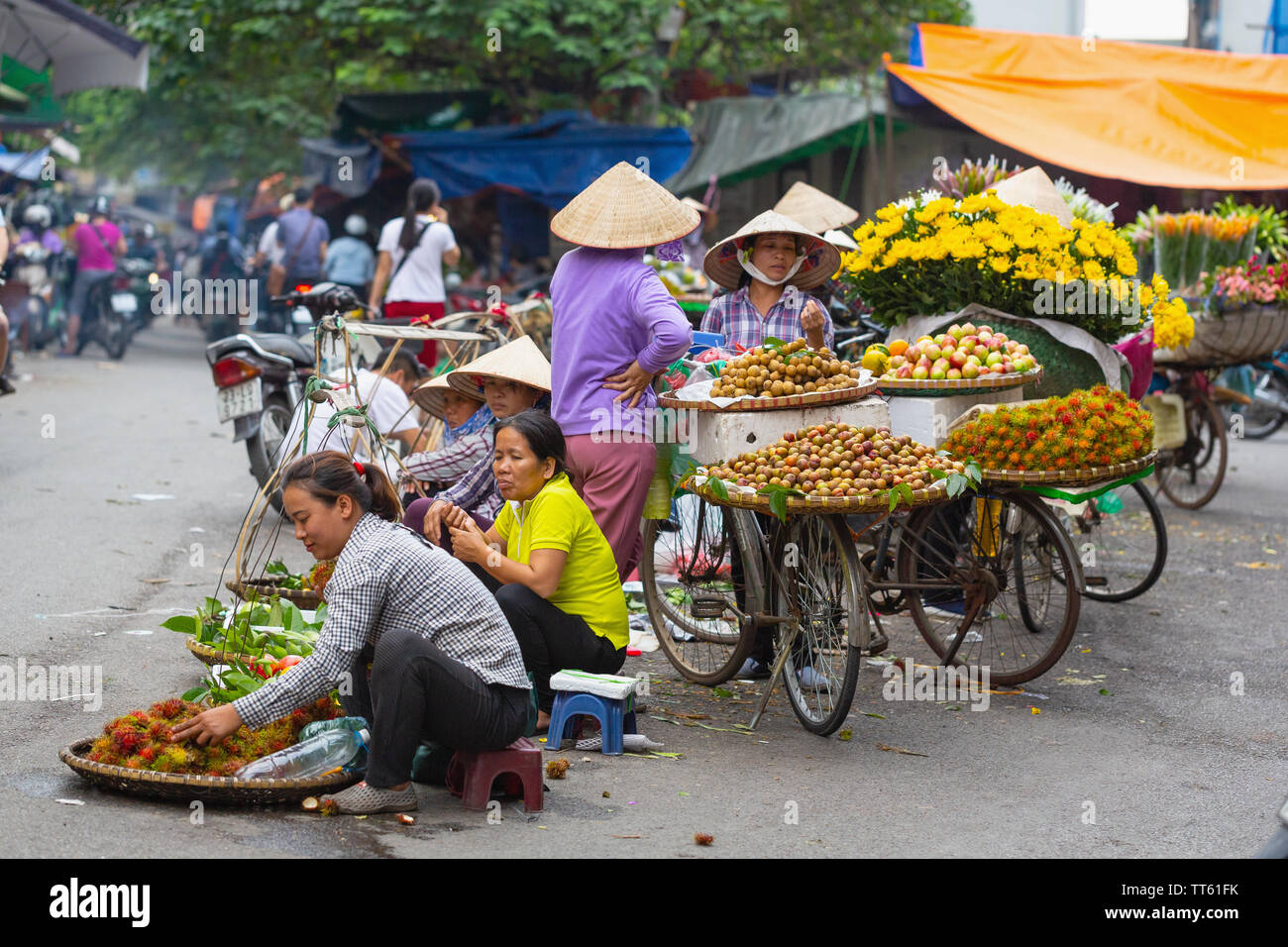 Group of women Fruit Vendors, Old Quarter, Hanoi, Vietnam, Asia Stock Photo