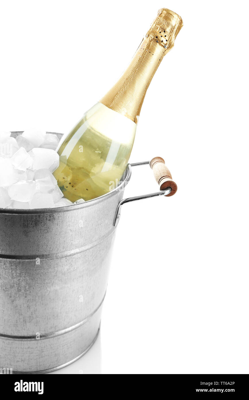 Bottle of champagne in metal ice bucket isolated on white Stock Photo