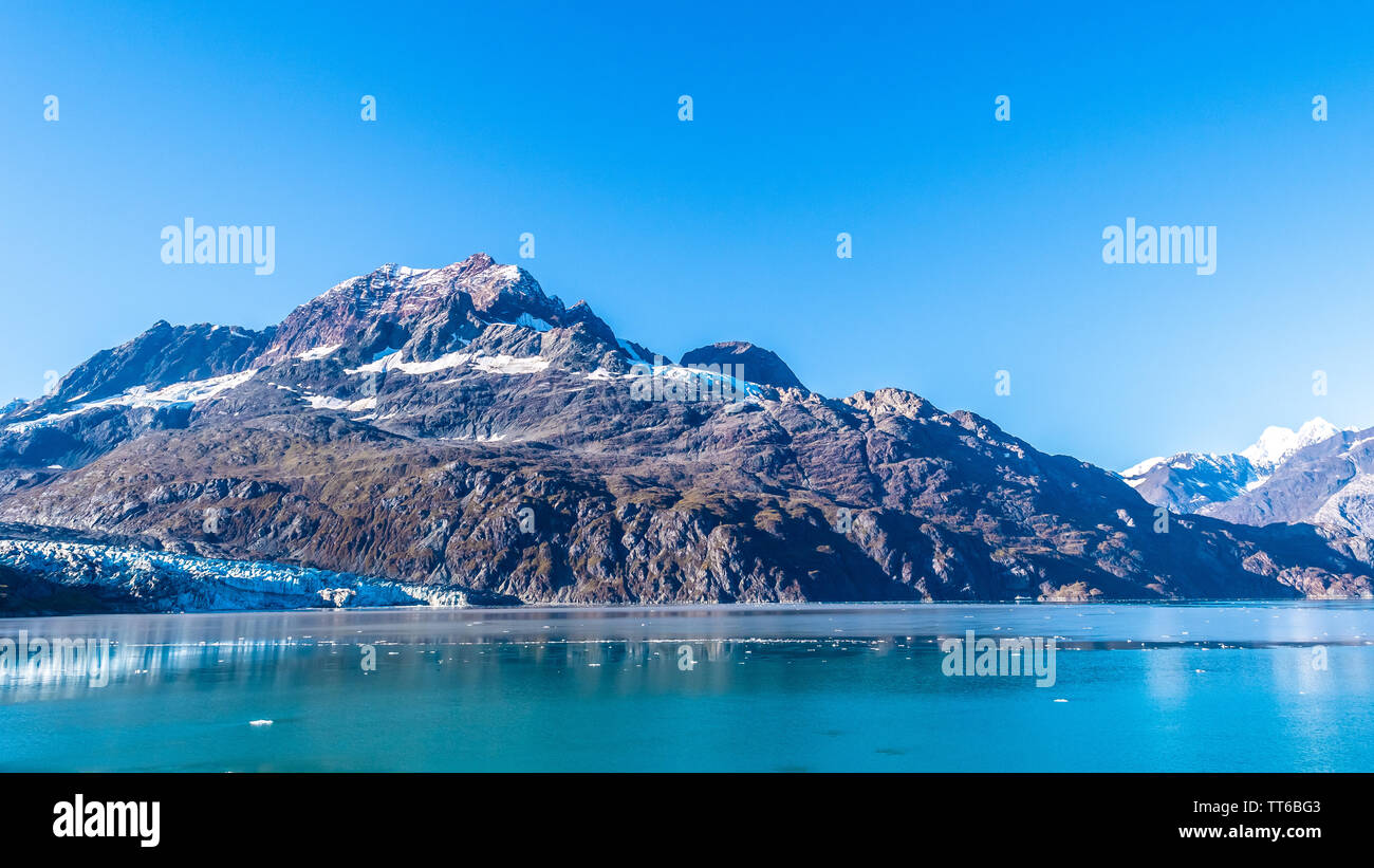 Glacier Bay National Park, Alaska. Spectacular sweeping vista of glaciers and ice capped/ snow covered mountains and wildlife landscape. Stock Photo