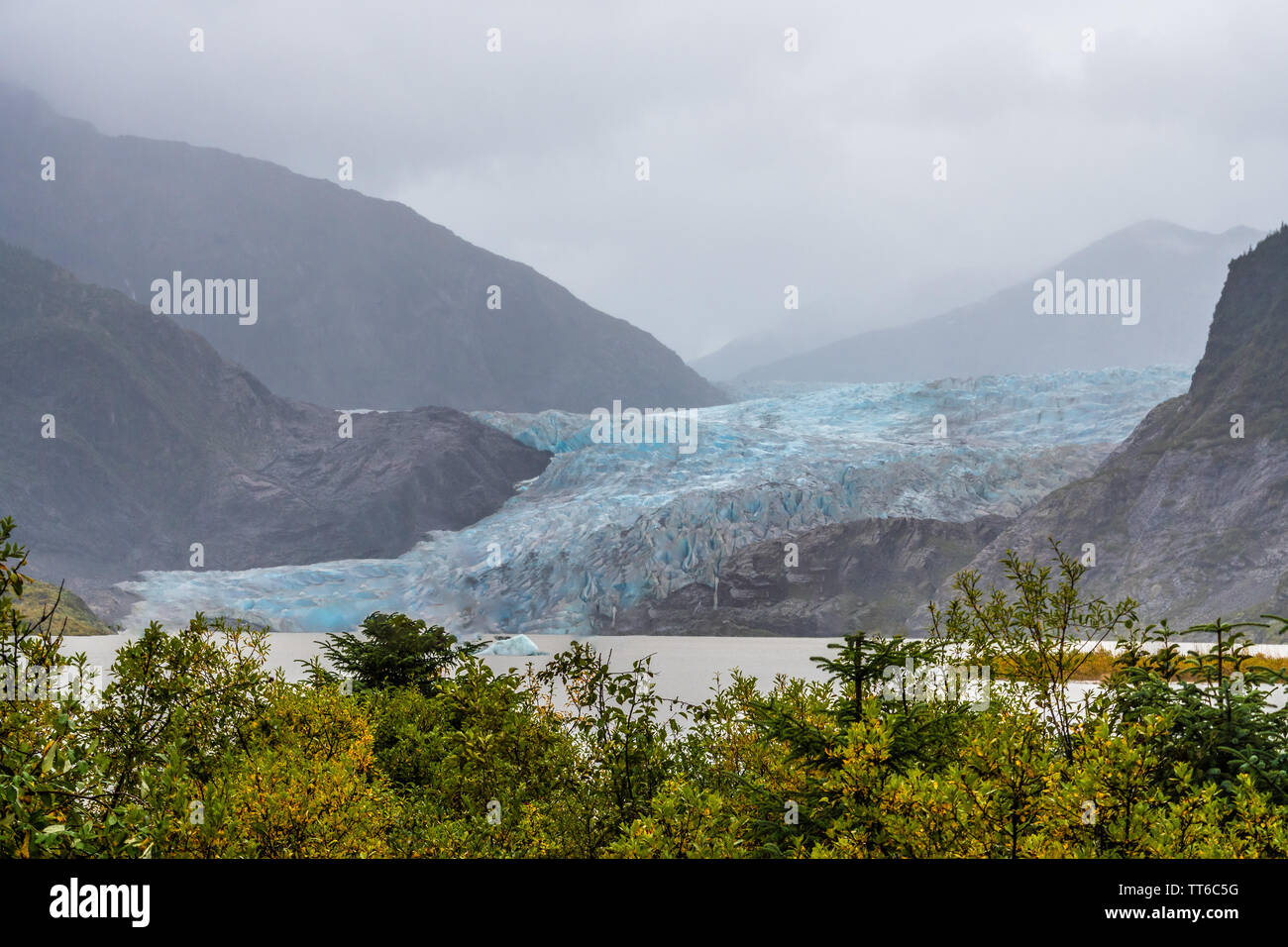 Mendenhall Glacier (Sitaantaagu), one of the most easily accessible Alaska glaciers, is a major glacier which flows from the Juneau Icefield. Stock Photo