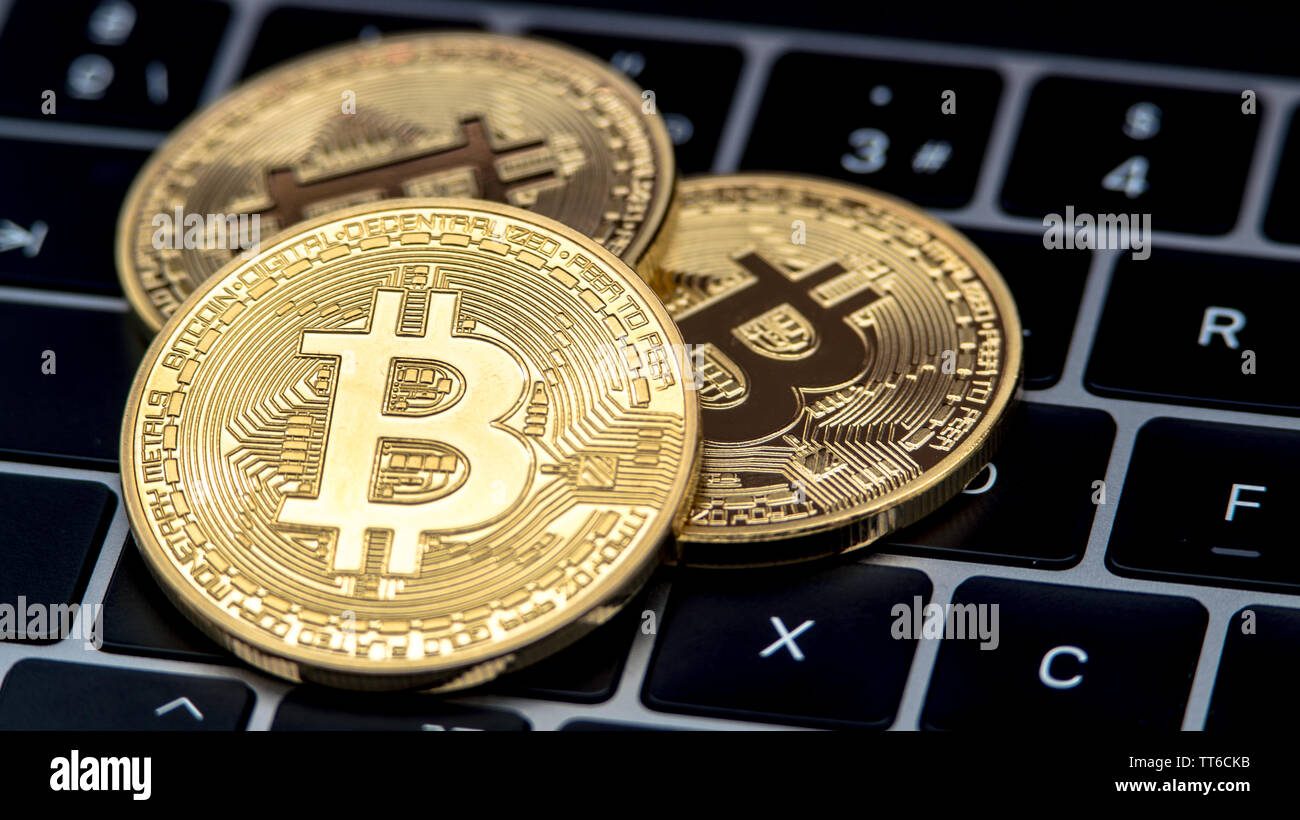 Physical metal golden Bitcoin currency on notebook computer keyboard.  Worldwide virtual internet money. Digital coin cyberspace, cryptocurrency  Stock Photo - Alamy
