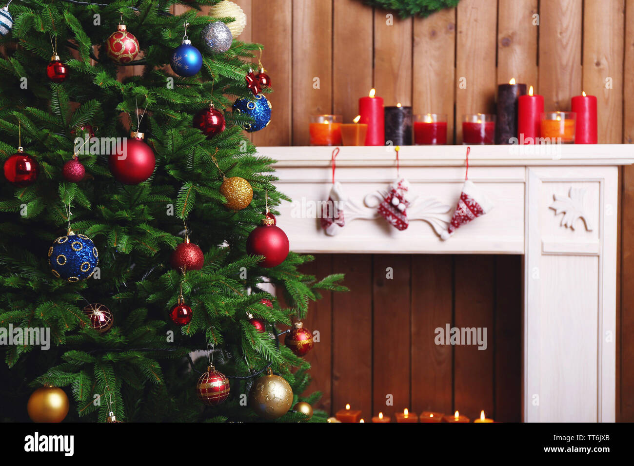 Fireplace With Beautiful Christmas Decorations In Room Stock Photo
