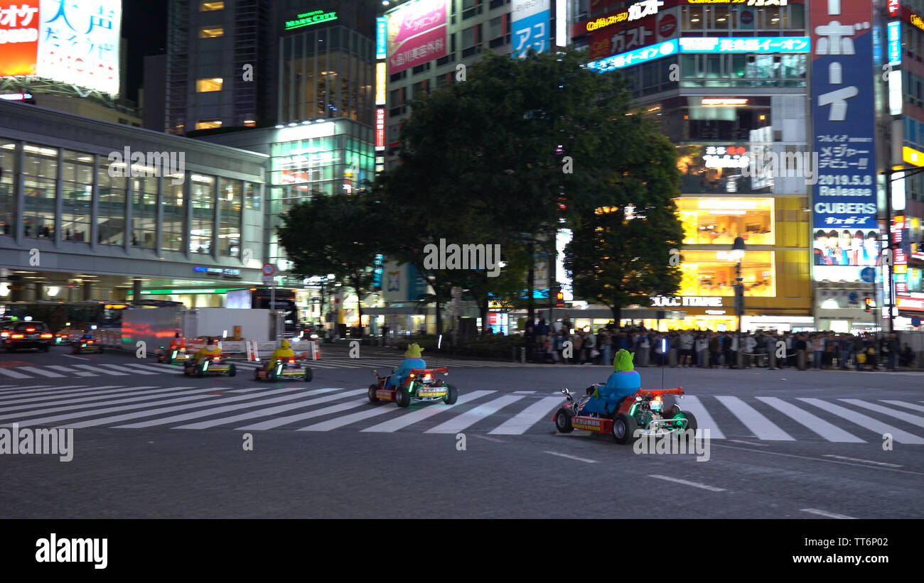 Mario kart running on Shibuya Crossing ( 4K UHD ). Tourist rent a Go-kart can drive on Shibuya district, Harajuku and Omotesando all the famous shoppi Stock Photo