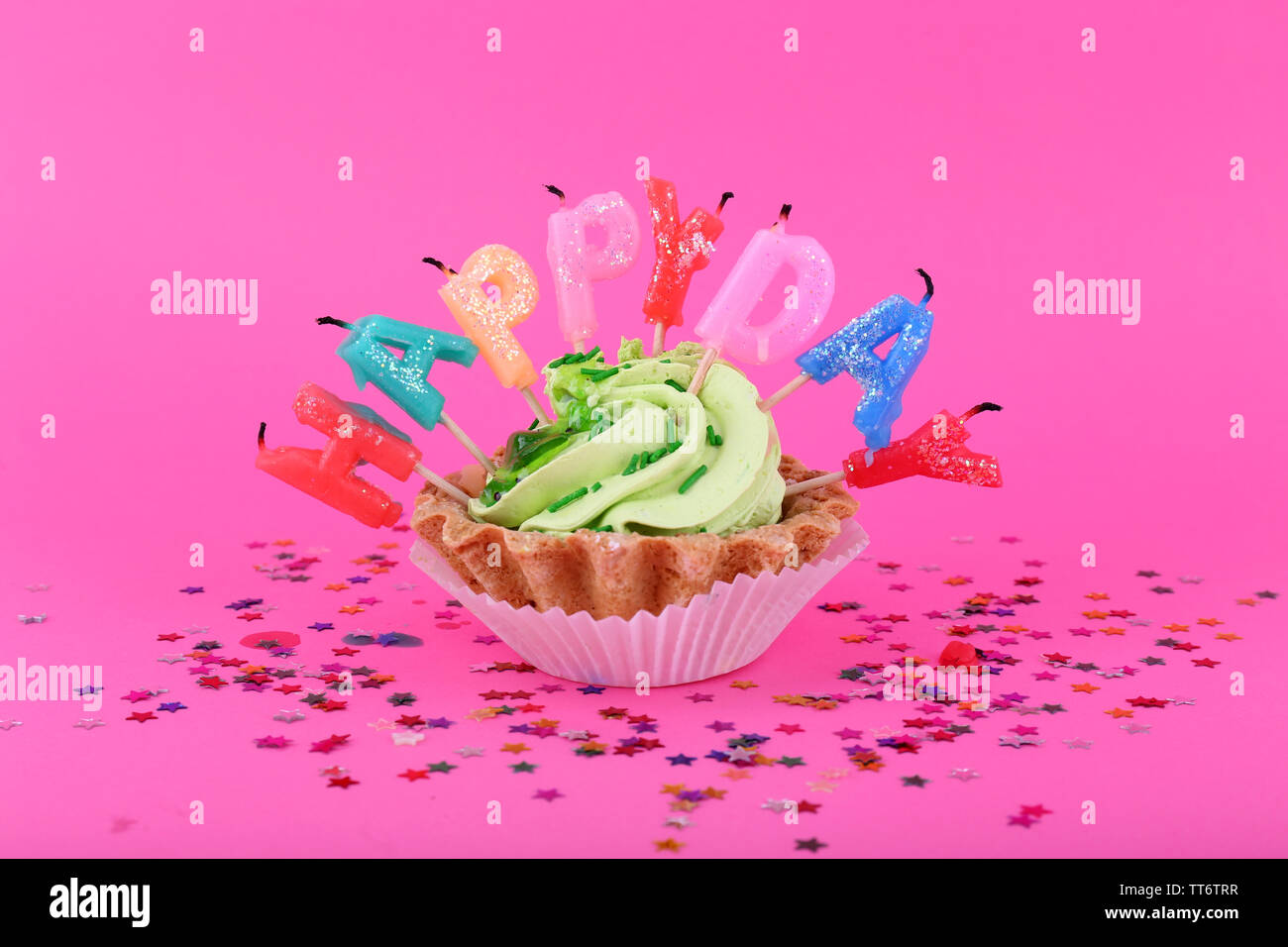 Cake with birthday candles on pink background Stock Photo - Alamy