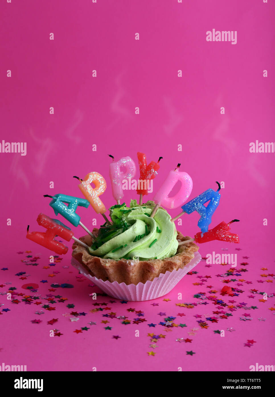 Cake with birthday candles on pink background Stock Photo - Alamy