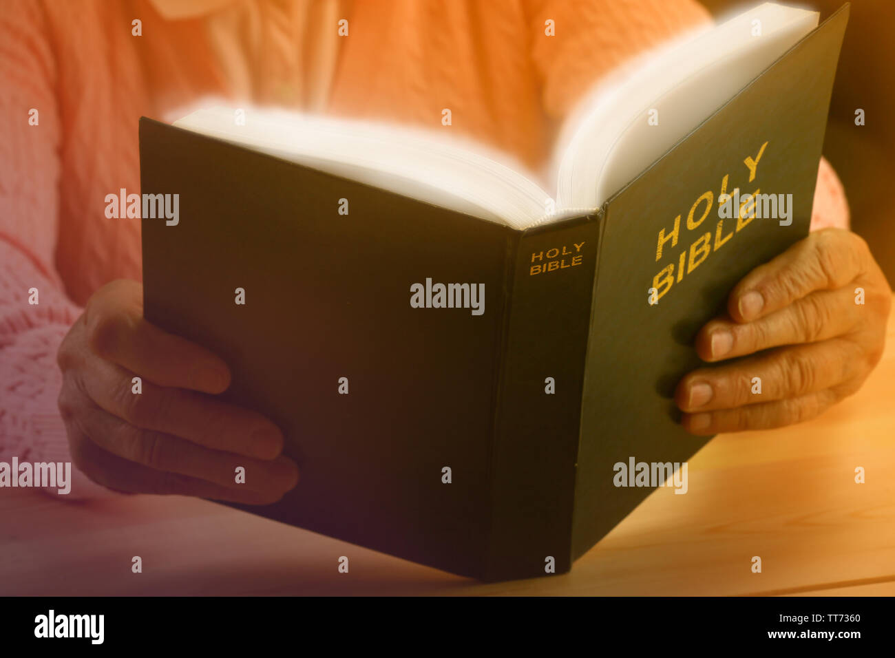 Old woman reading Bible, closeup Stock Photo - Alamy