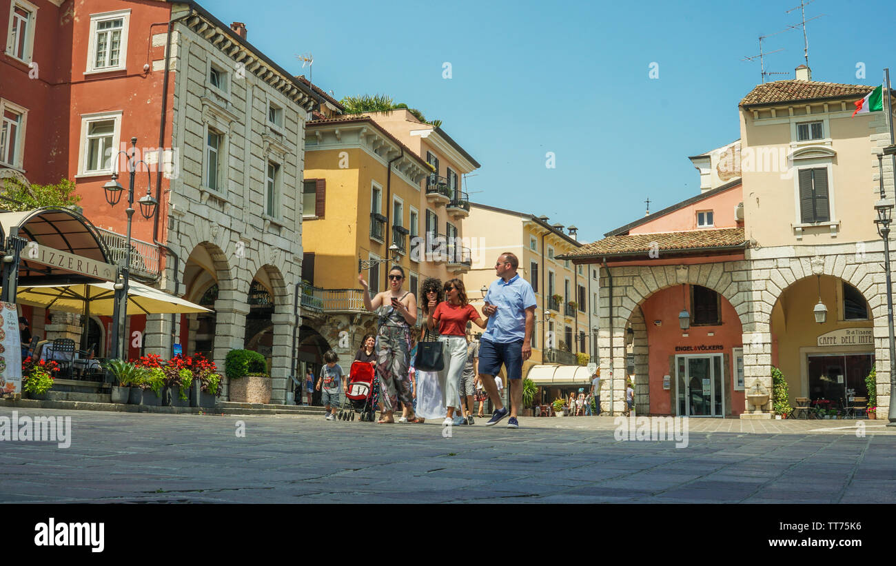 Piazza malvezzi Desenzano del Garda Italy daytime with people walking trough Stock Photo