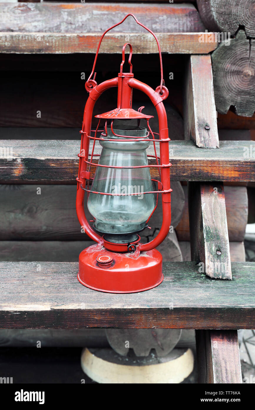 Kerosene lamp on wooden stairs, outdoors Stock Photo