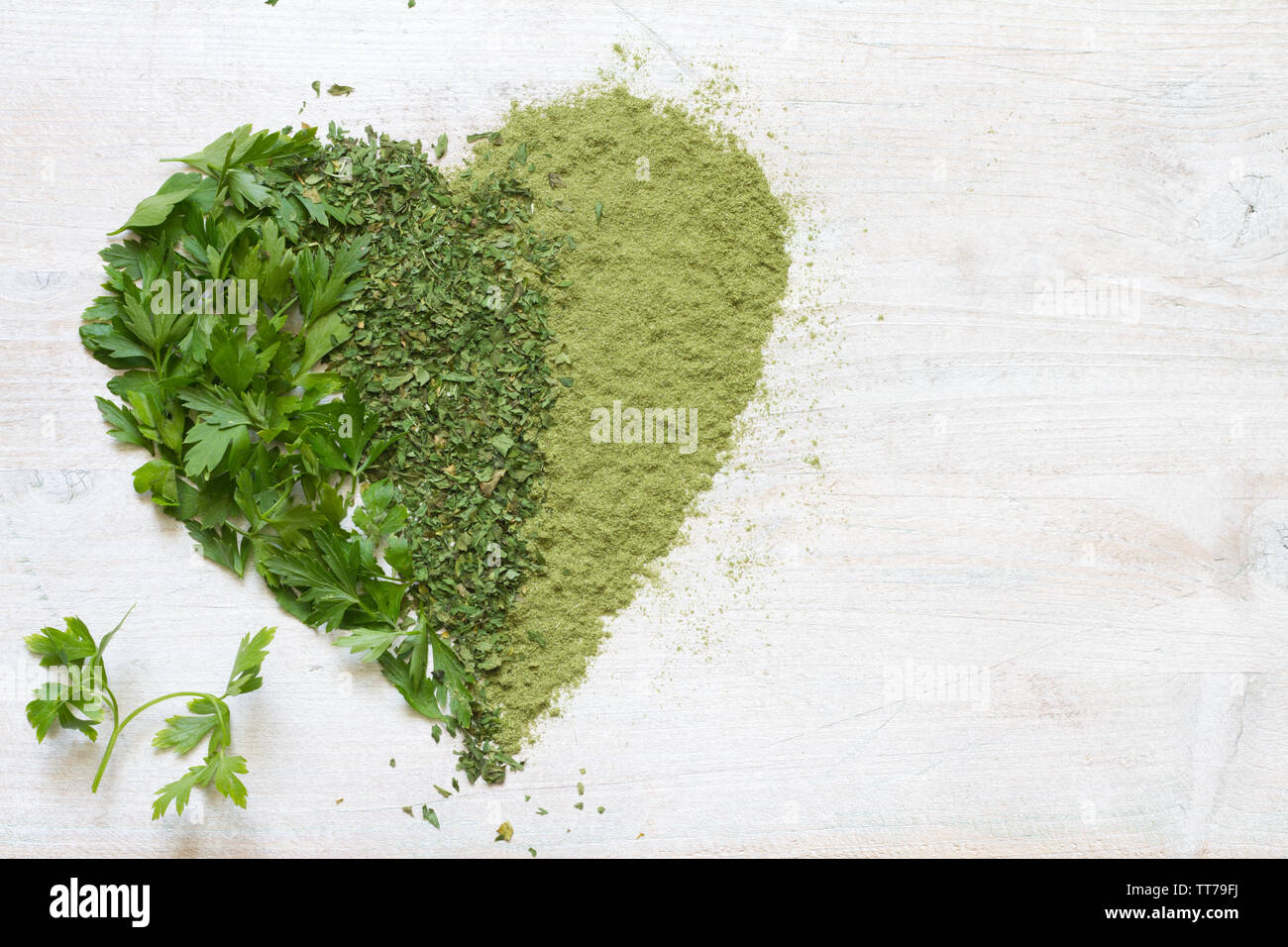 Green vegetables and herbs in heart health concept Stock Photo