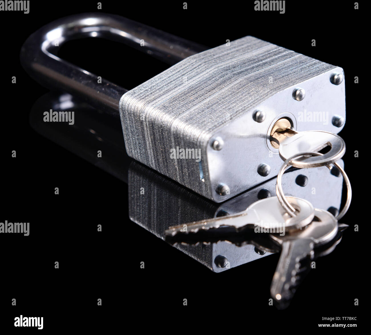 Padlock with keys isolated on black Stock Photo