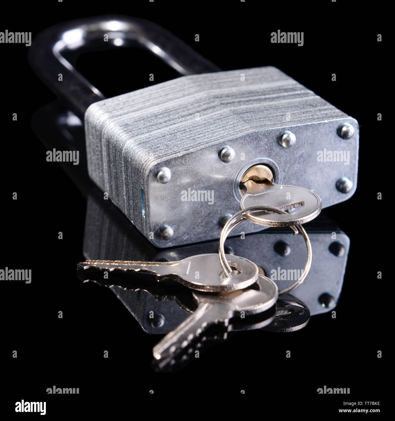 Padlock with keys isolated on black Stock Photo