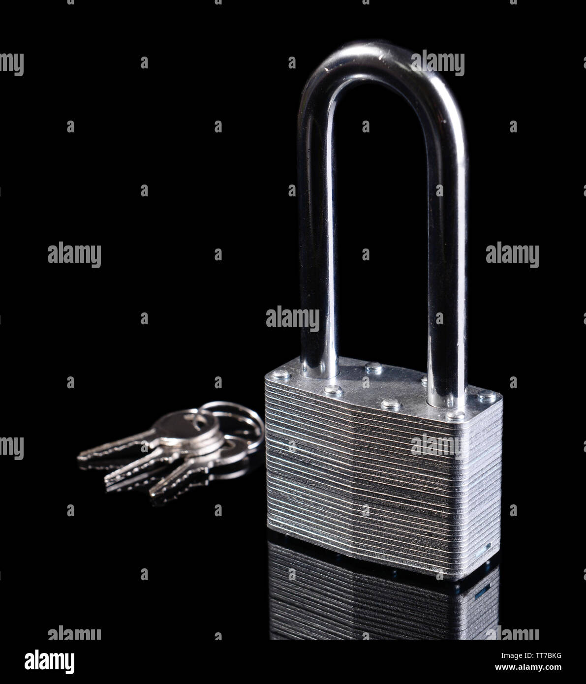 Padlock with keys isolated on black Stock Photo