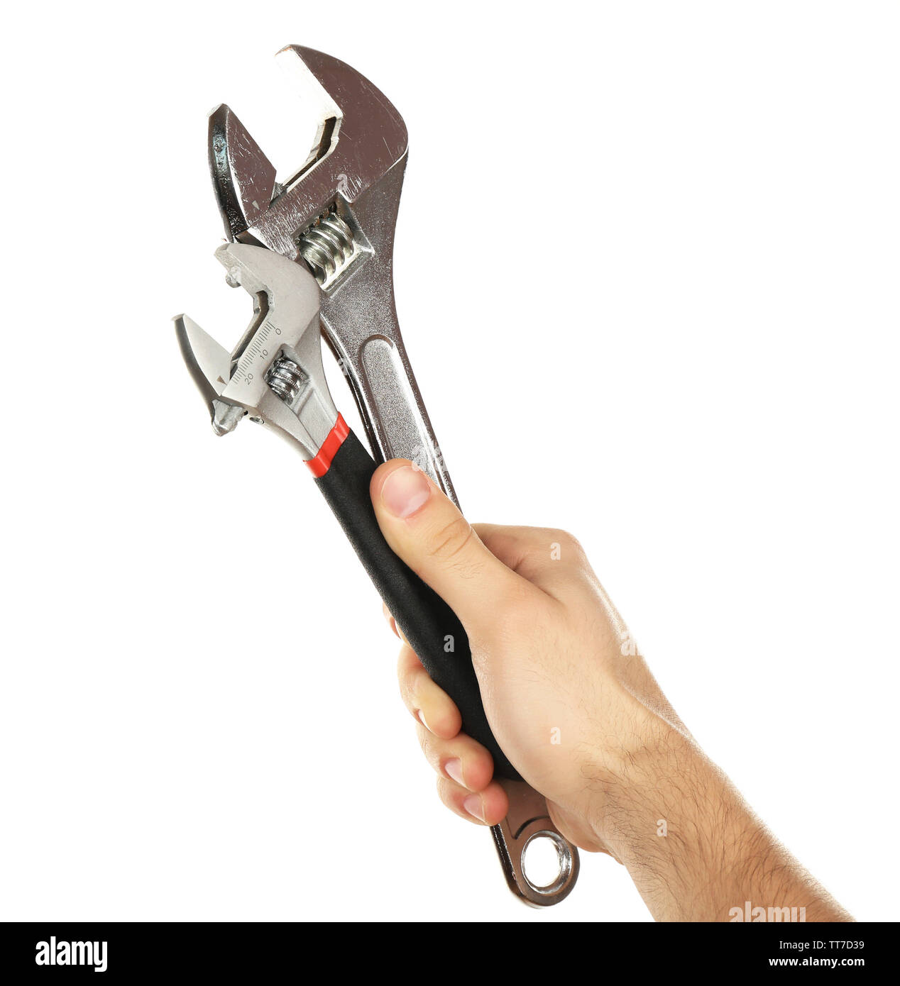 Adjustable wrenches in male hand isolated on white Stock Photo Alamy