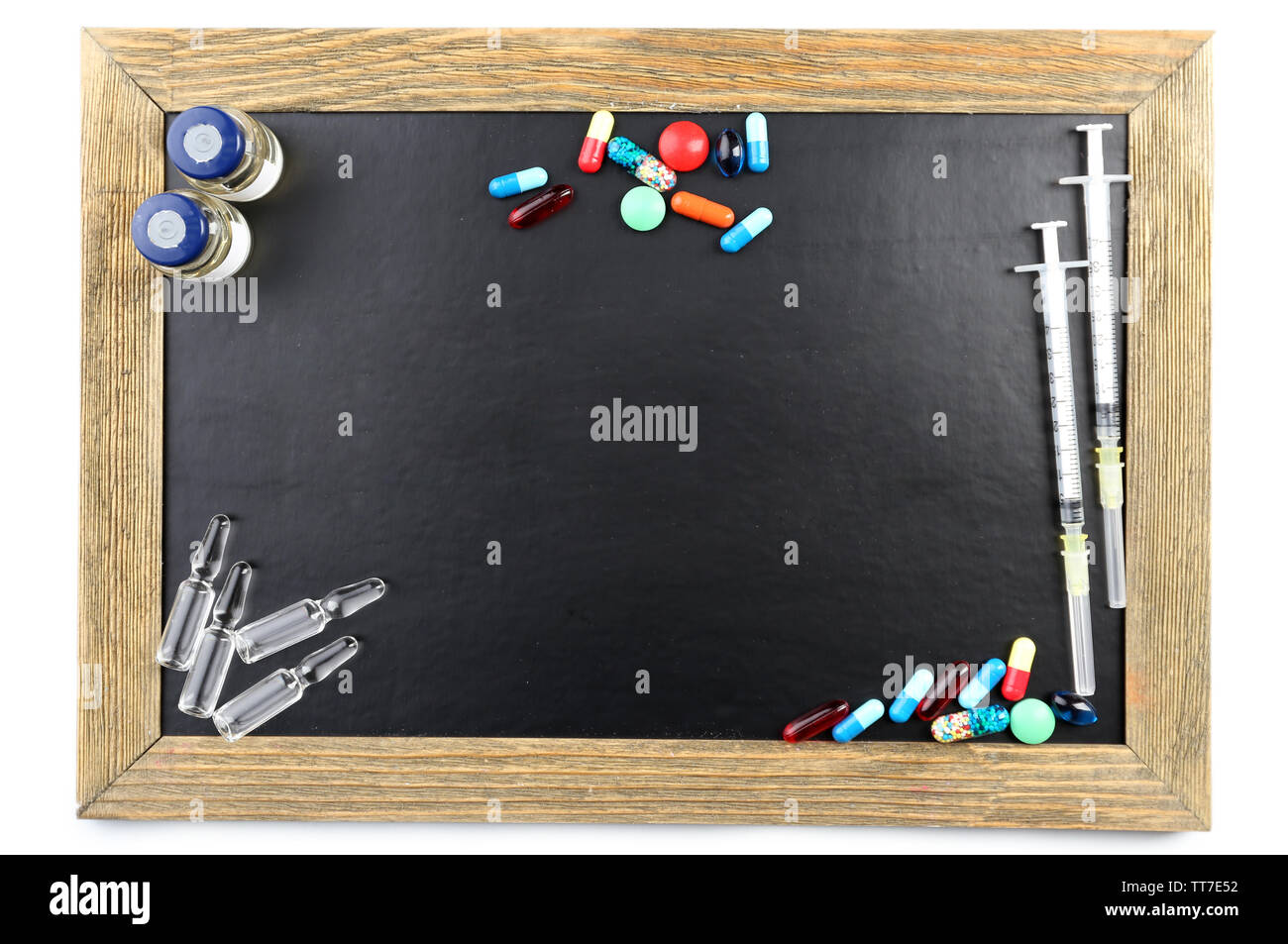 Blank blackboard with medicines isolated on white background Stock