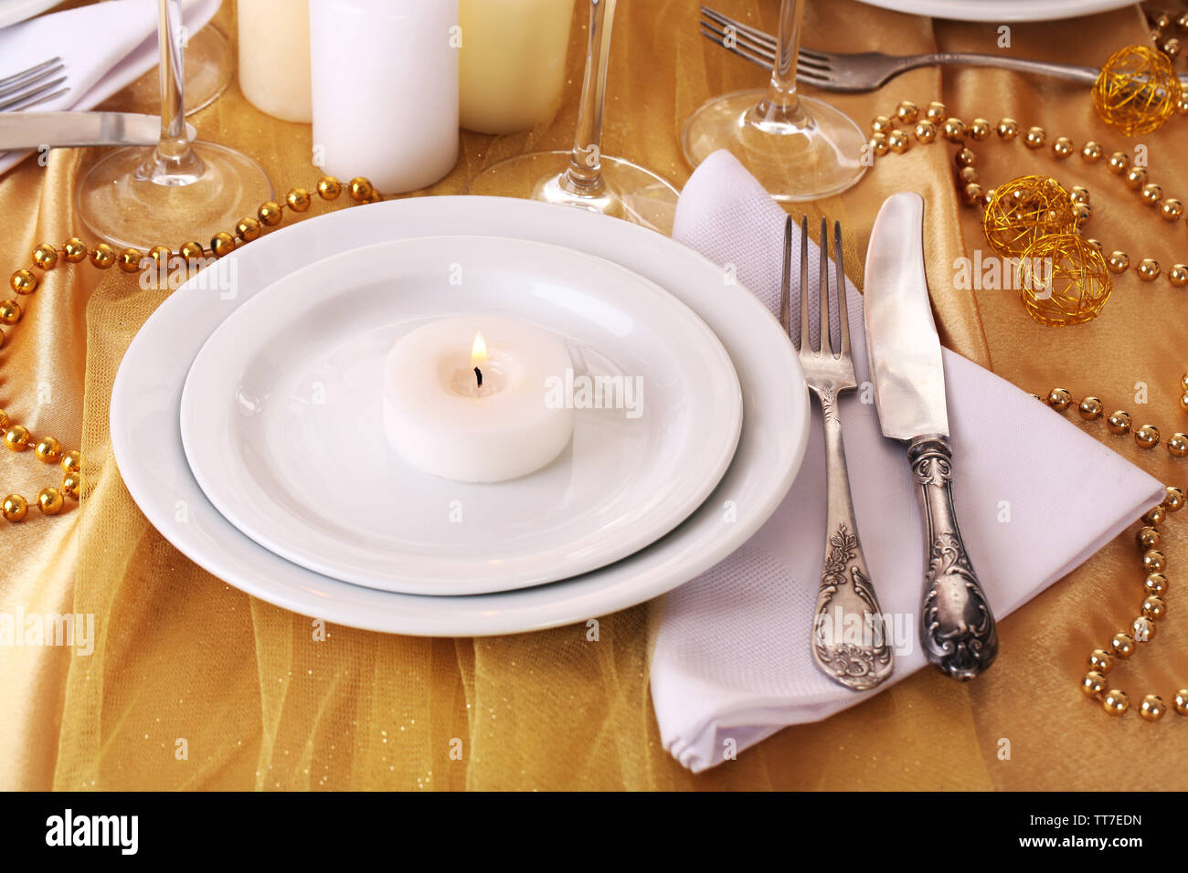 Beautiful holiday table setting in white and gold color Stock Photo - Alamy