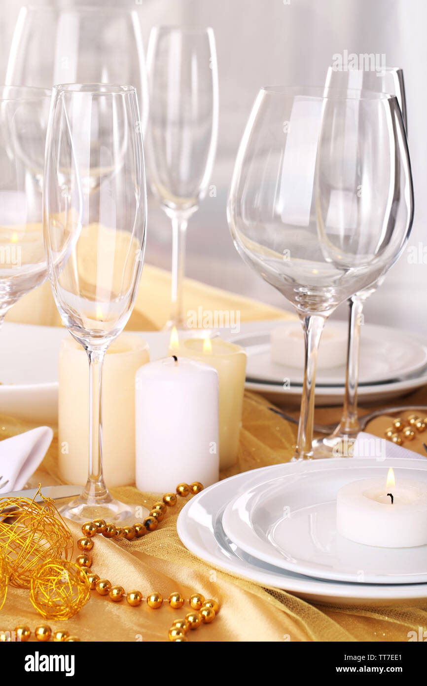 Beautiful holiday table setting in white and gold color Stock Photo - Alamy