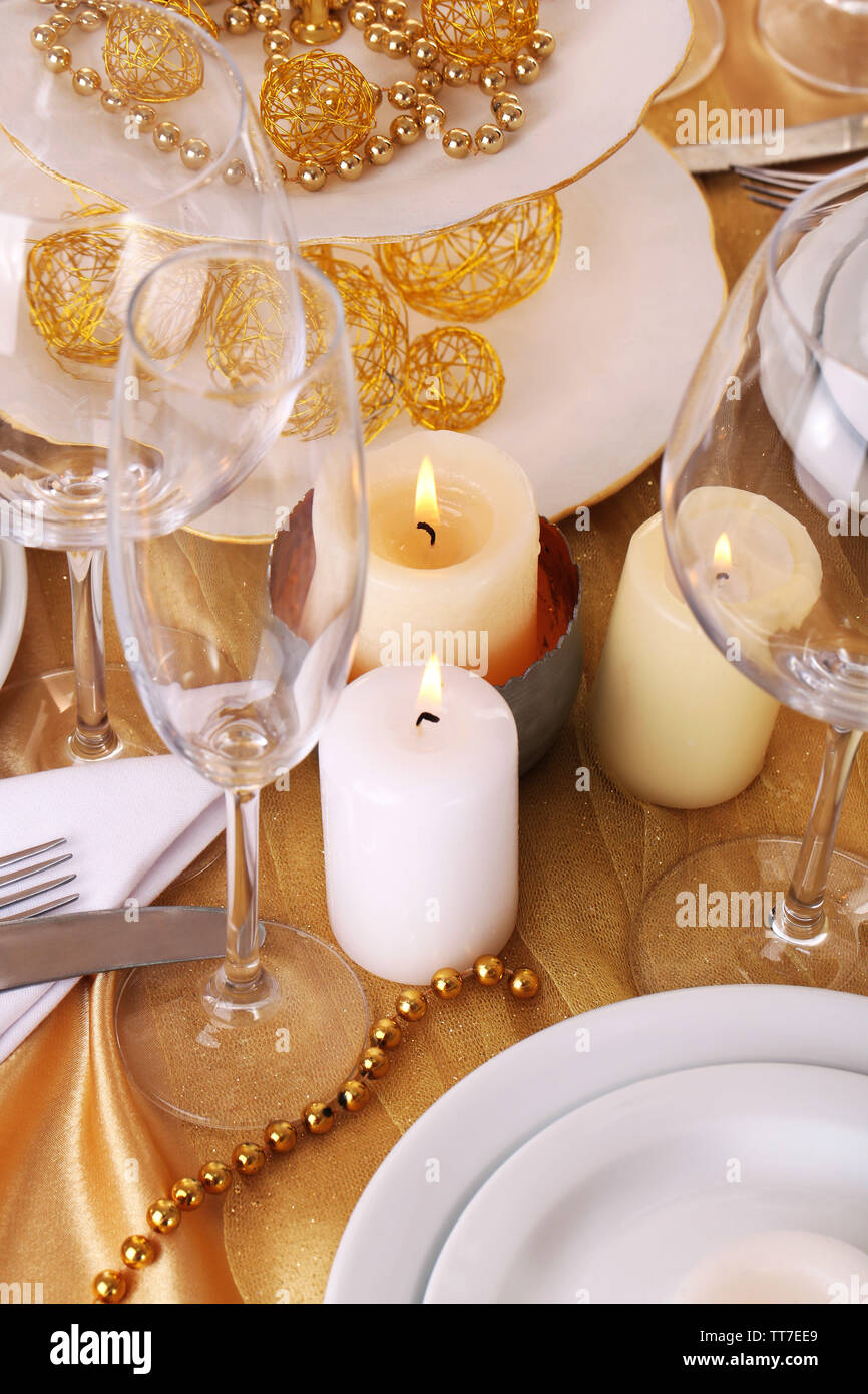 Beautiful holiday table setting in white and gold color Stock Photo - Alamy