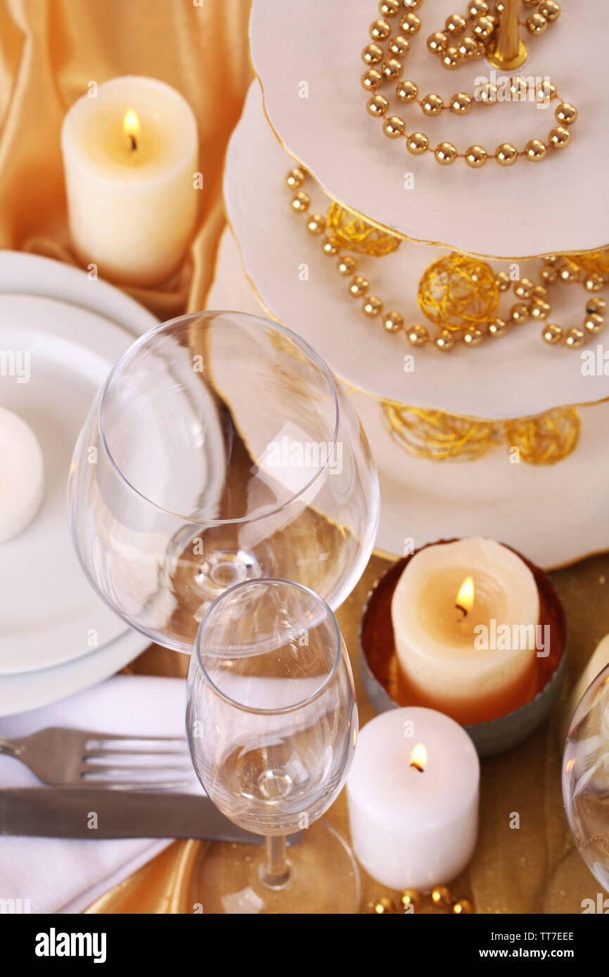 Beautiful holiday table setting in white and gold color Stock Photo - Alamy