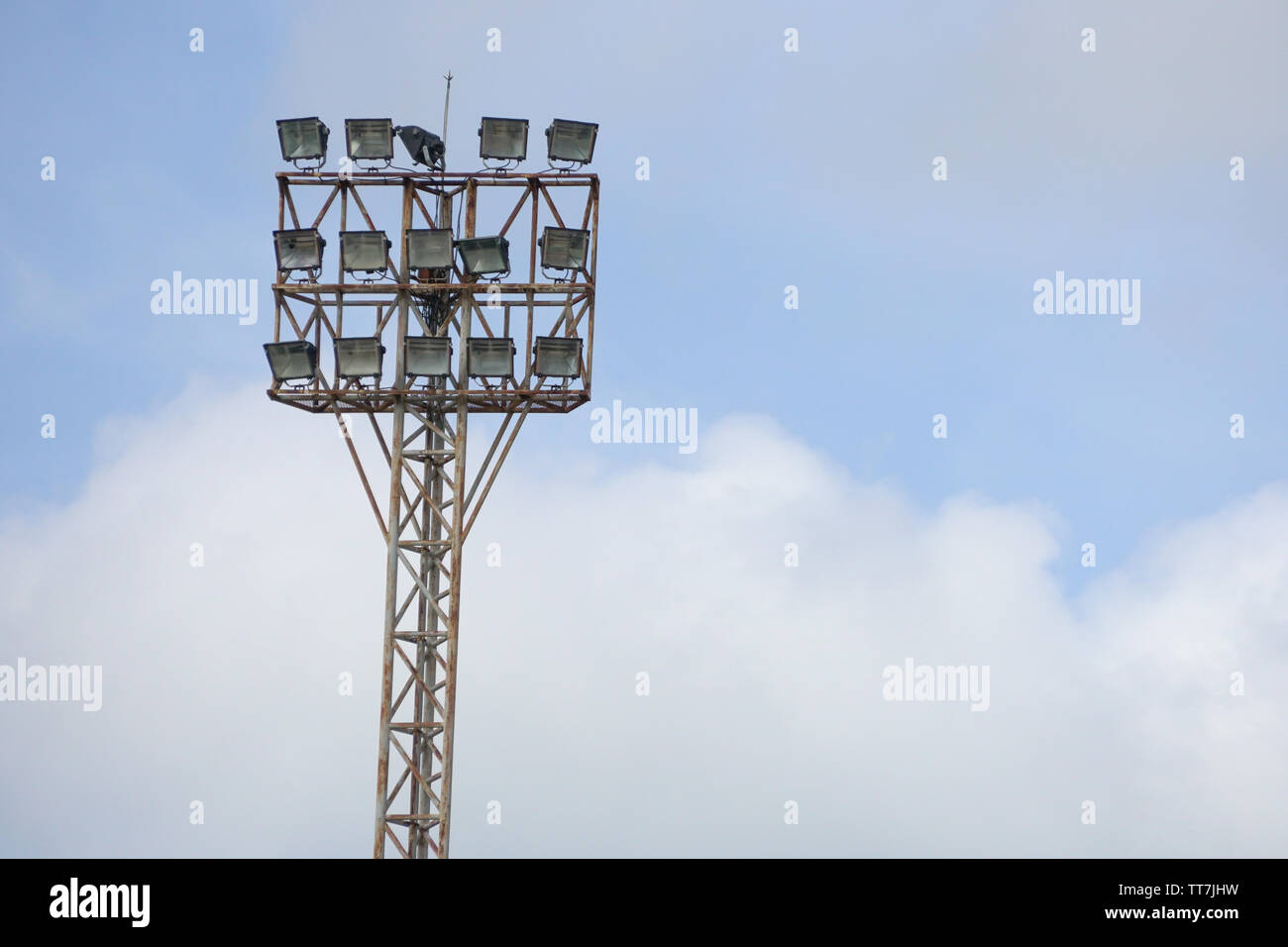 Large lighting tower with spotlights with blue sky background Stock Photo