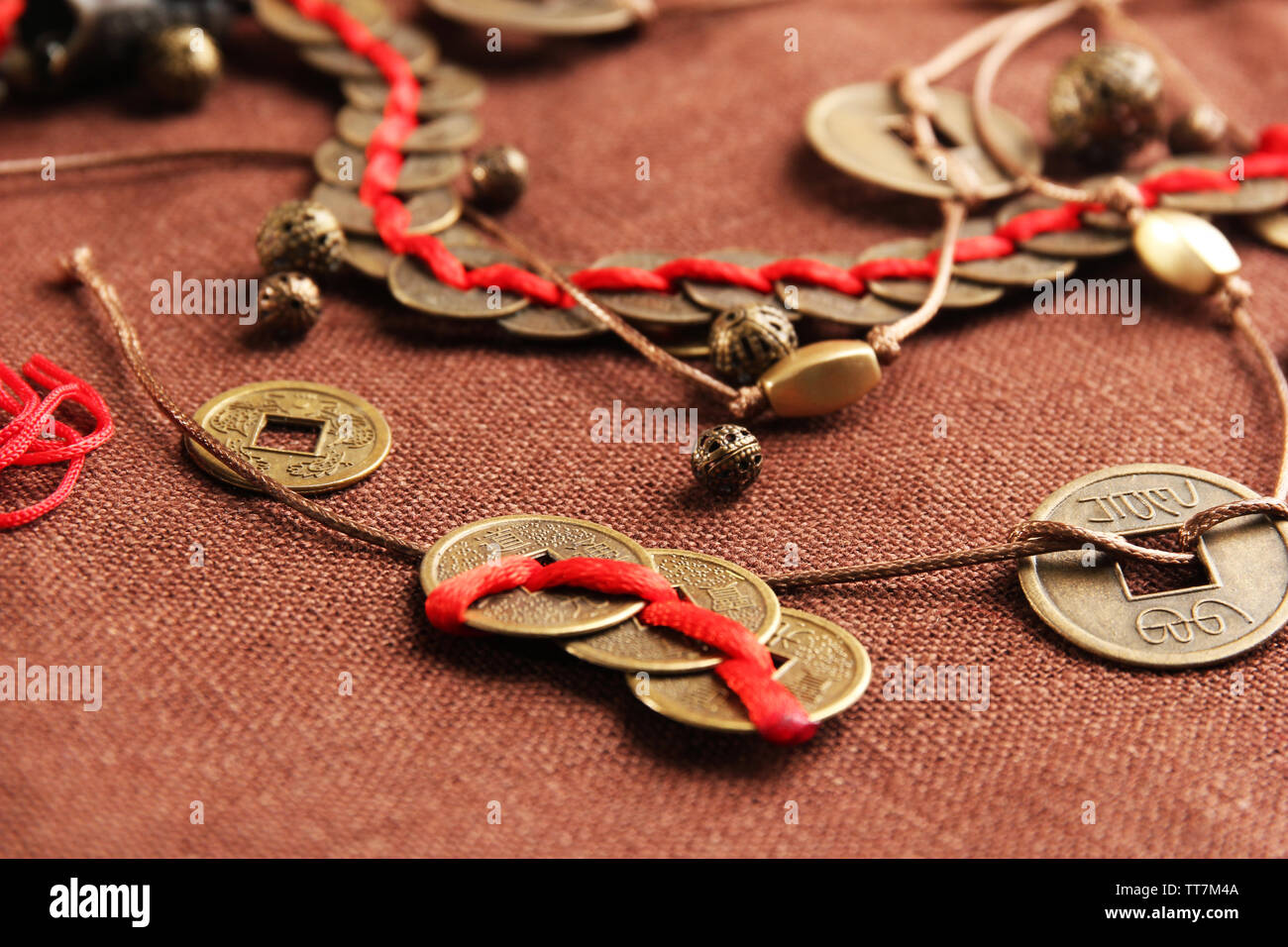 Chinese coins red ribbon hi-res stock photography and images - Alamy