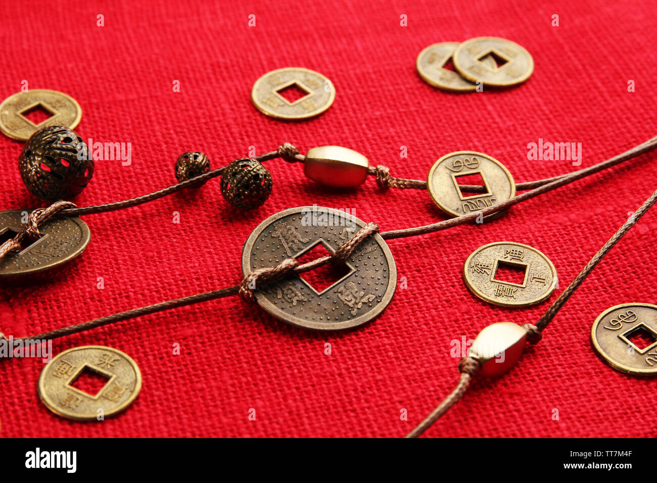 Chinese coins red ribbon hi-res stock photography and images - Alamy