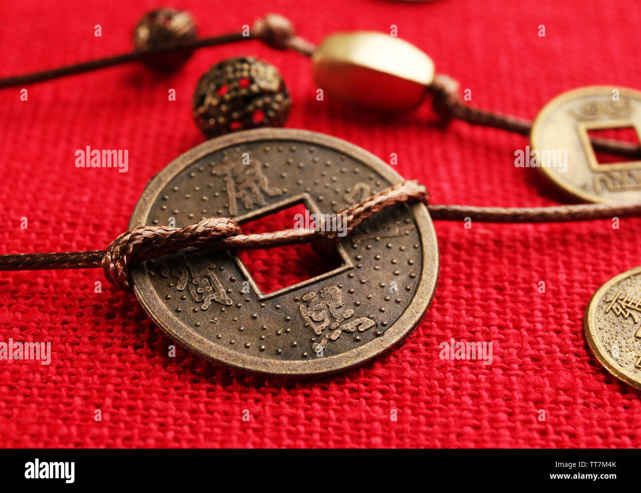Chinese coins red ribbon hi-res stock photography and images - Alamy