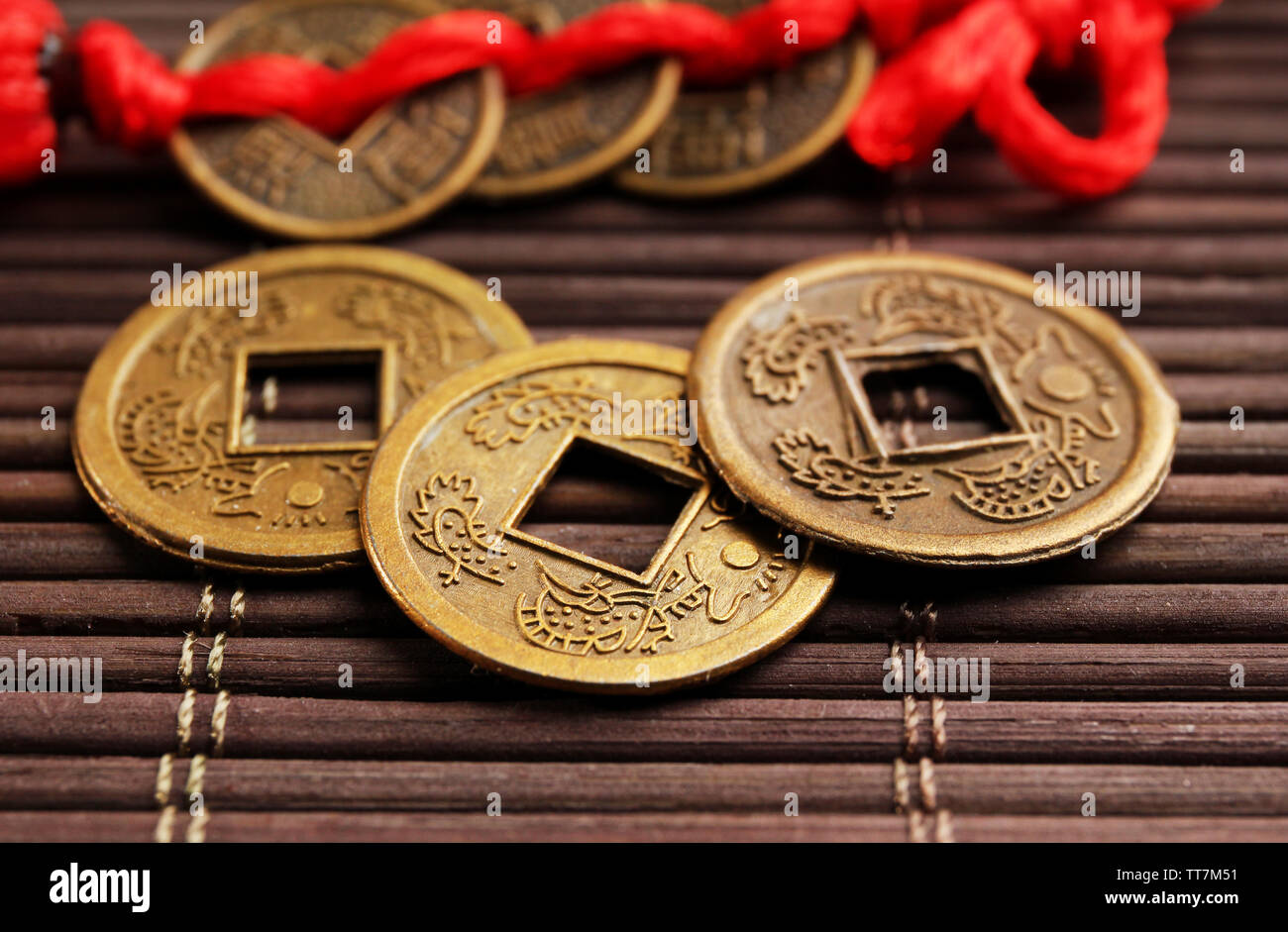 Chinese coins red ribbon hi-res stock photography and images - Alamy
