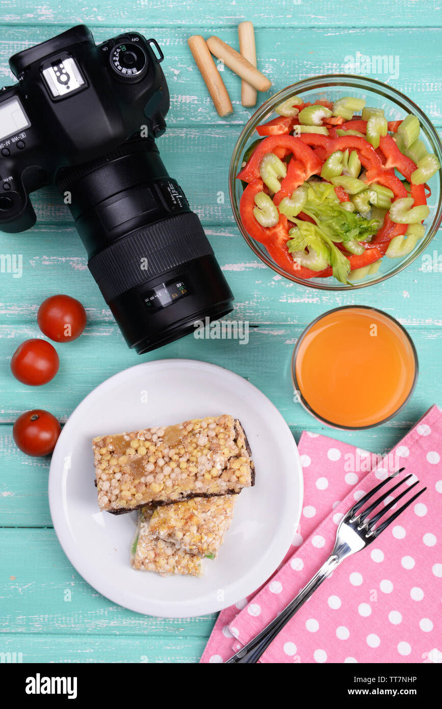 Delicious breakfast and camera on table top view Stock Photo - Alamy
