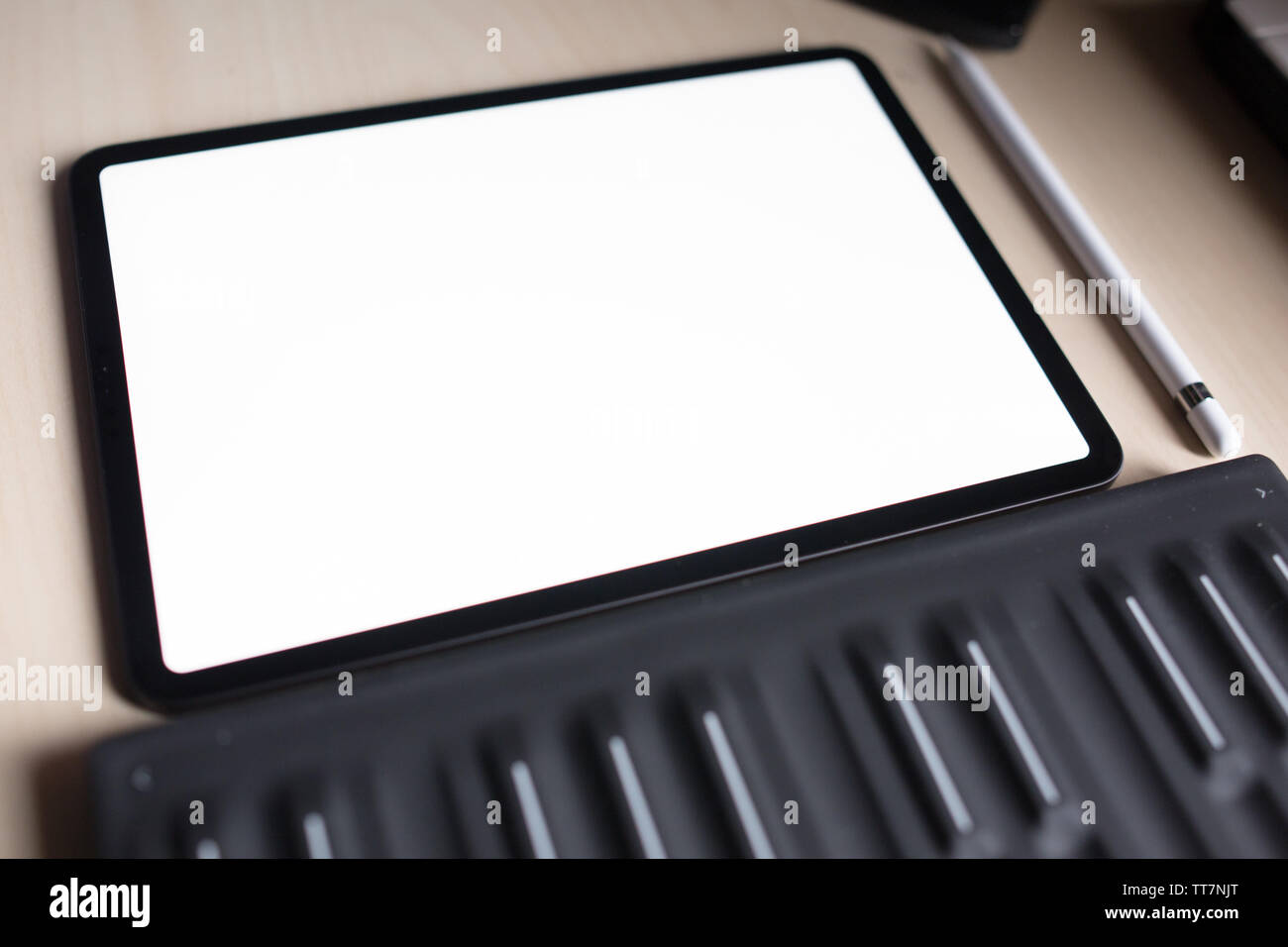 pro tablet for artist with pencil flat lay top view with midi keyboard and synthesizer Stock Photo