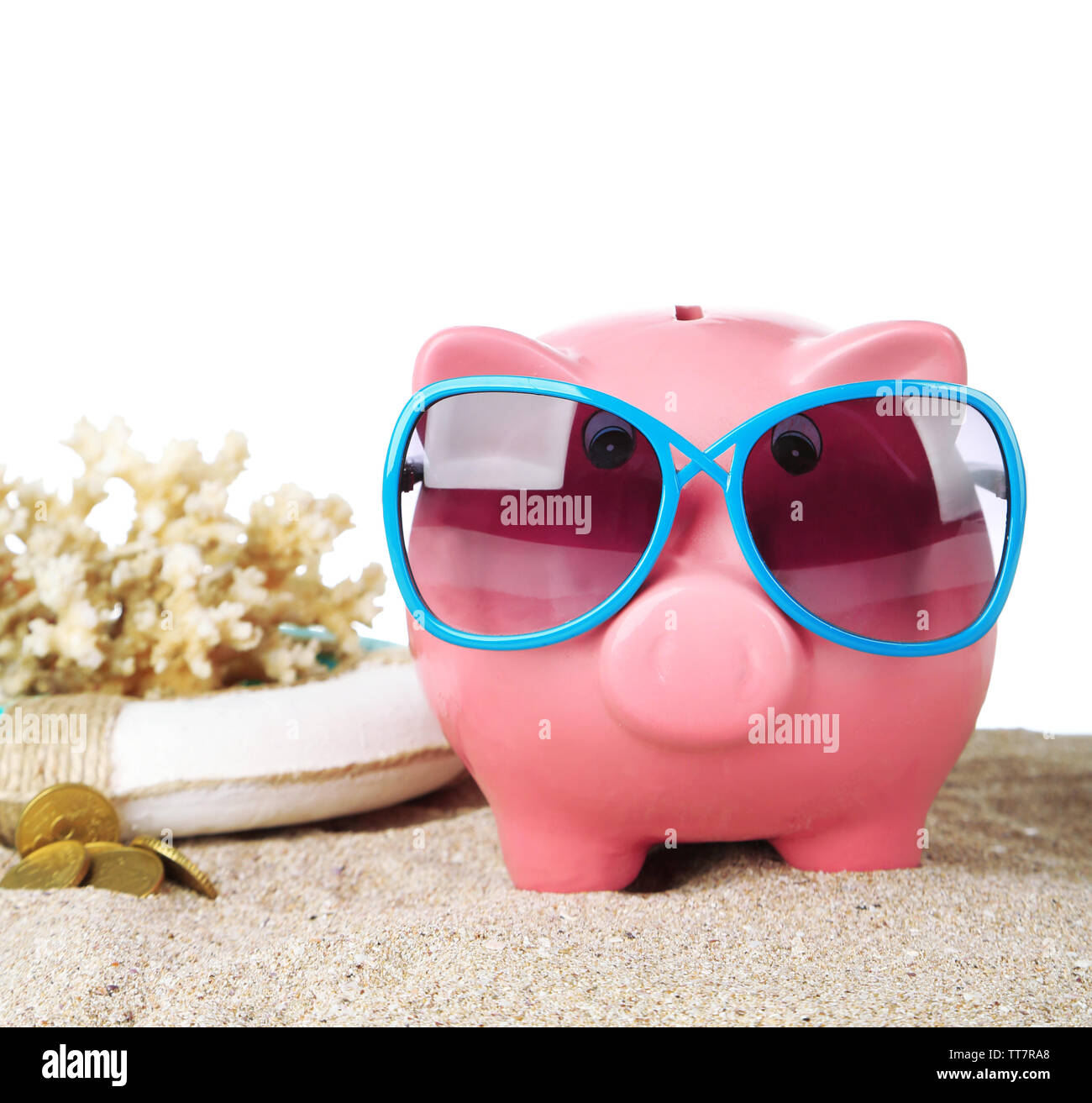 Piggy bank with sunglasses on sand, on white background Stock Photo - Alamy