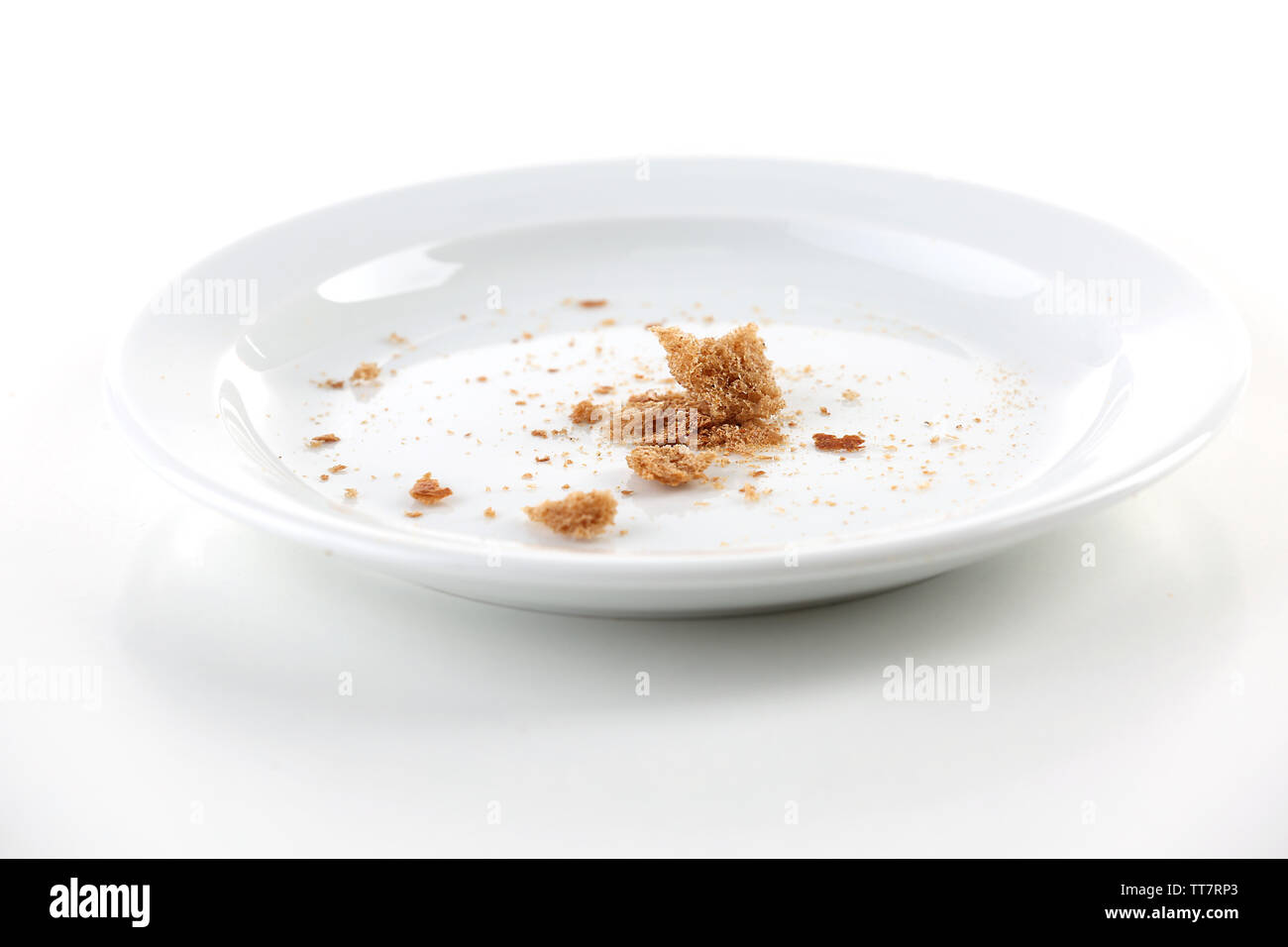 Bread crumbs on plate isolated on white Stock Photo Alamy
