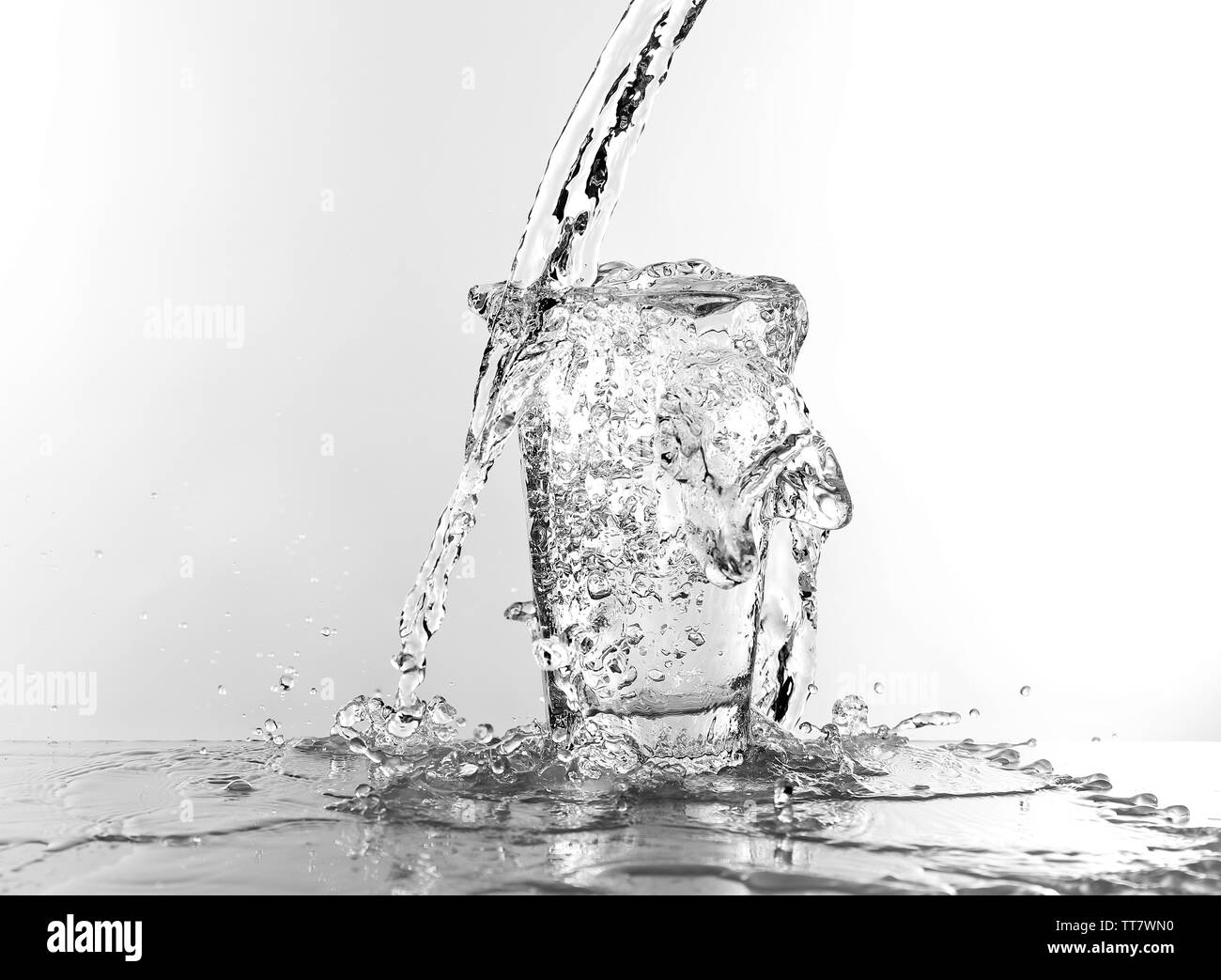 Water pouring in glass isolated on white Stock Photo Alamy