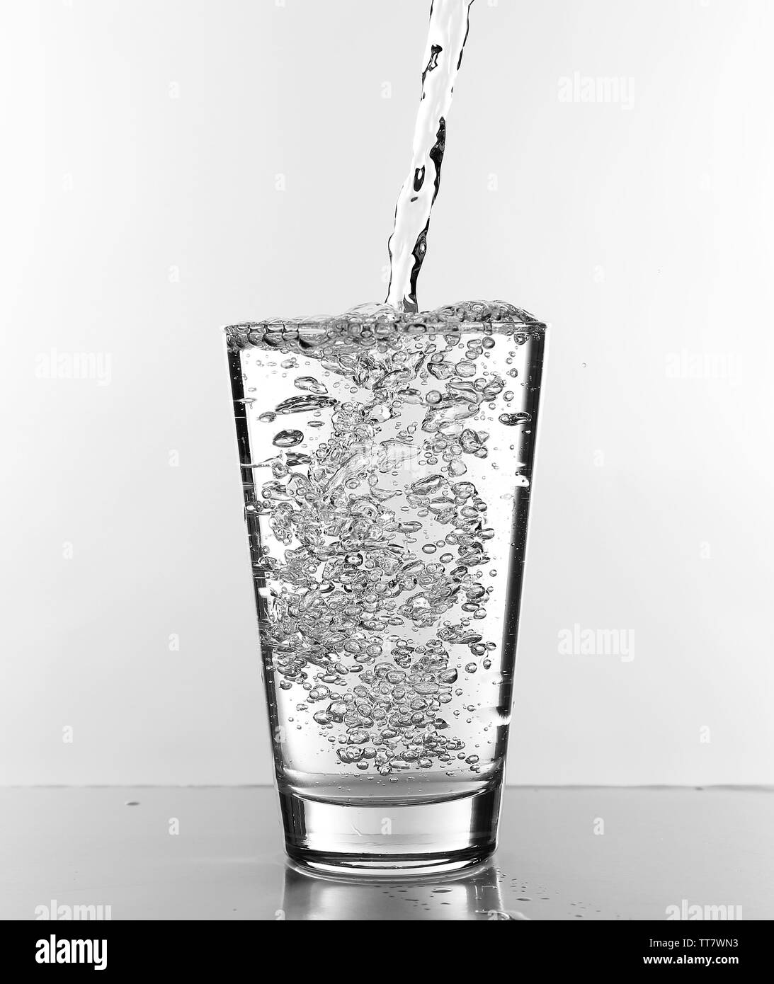 Water pouring in glass isolated on white Stock Photo Alamy