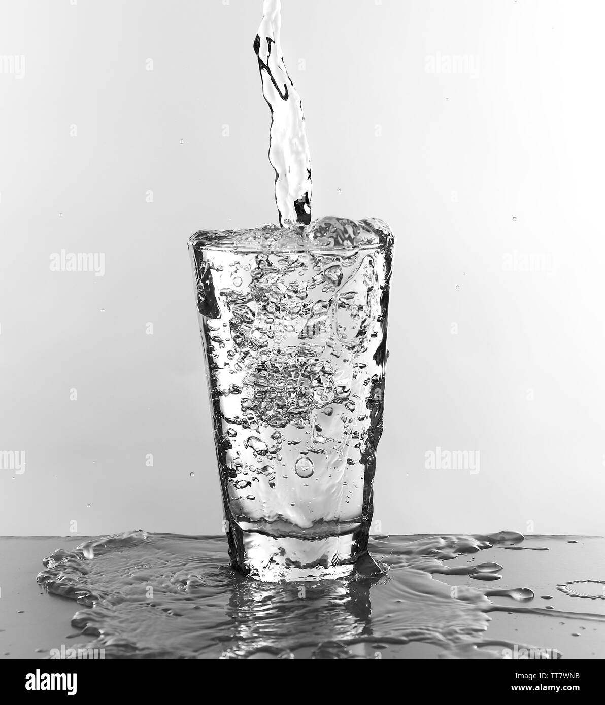 Water pouring in glass isolated on white Stock Photo Alamy