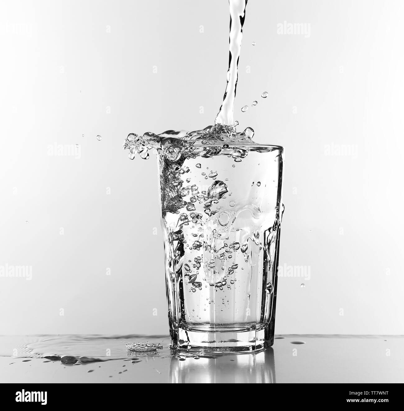 Water pouring in glass isolated on white Stock Photo Alamy