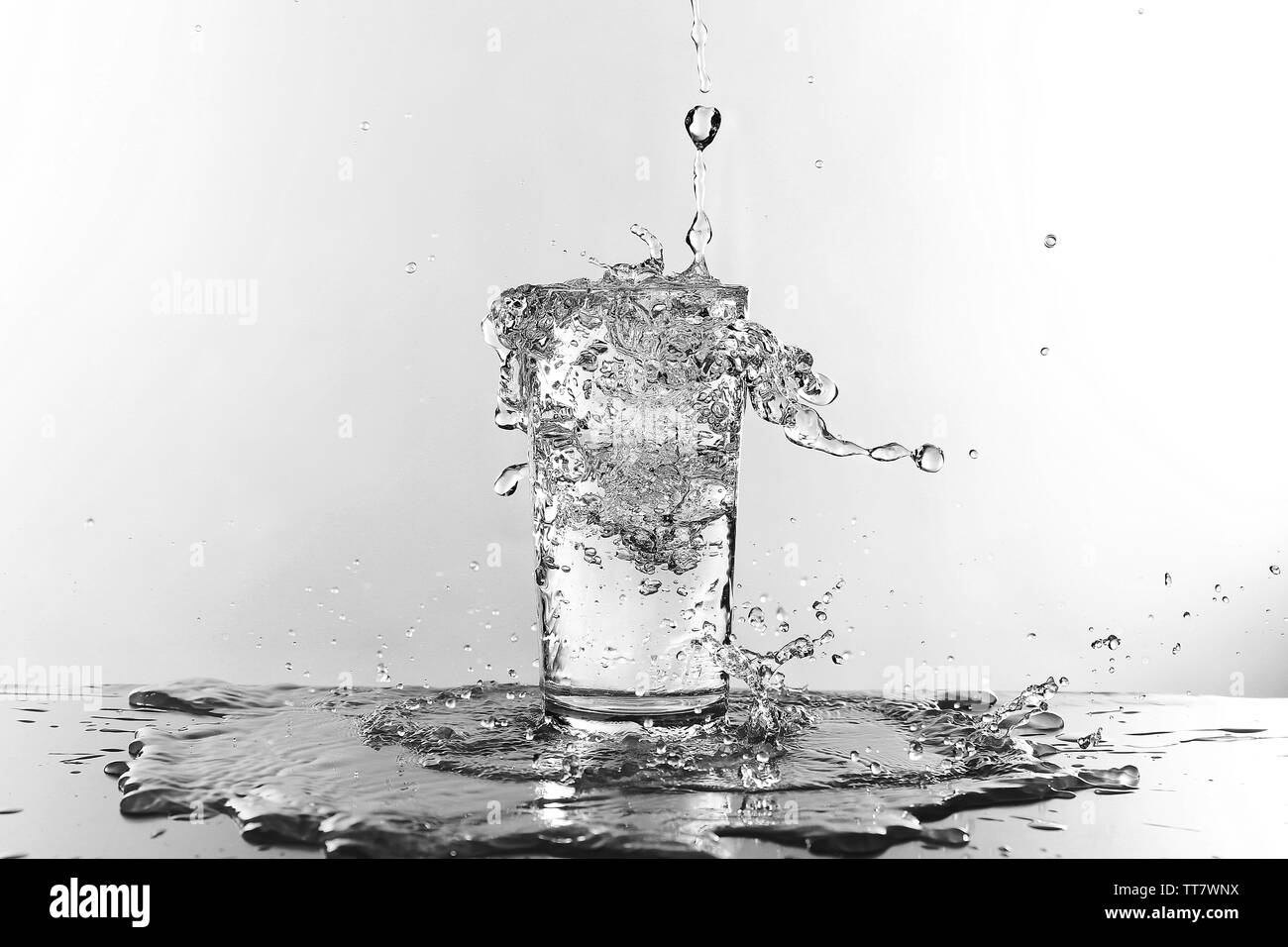 Water pouring in glass isolated on white Stock Photo Alamy