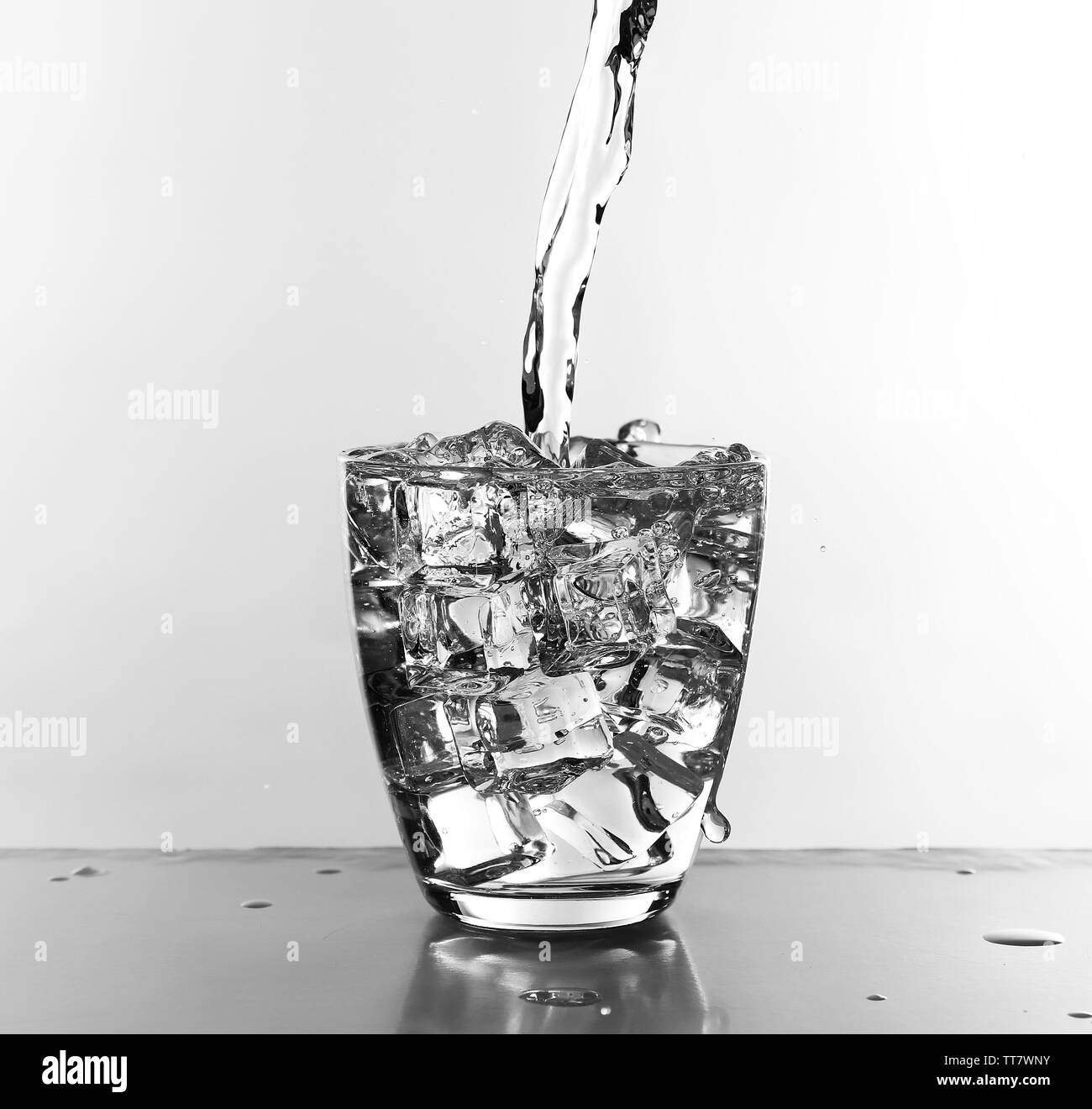 Water pouring in glass isolated on white Stock Photo Alamy
