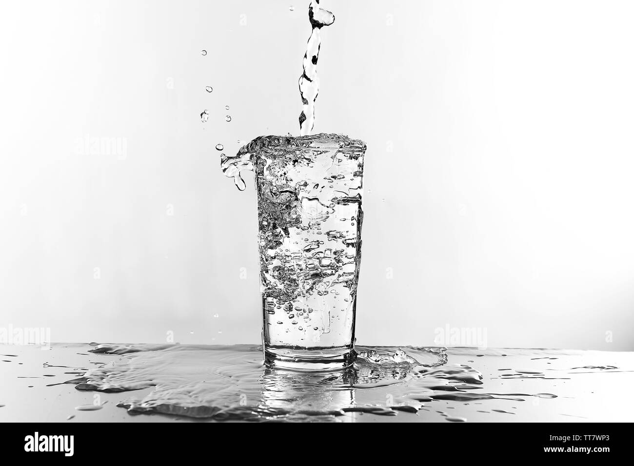Water pouring in glass isolated on white Stock Photo Alamy