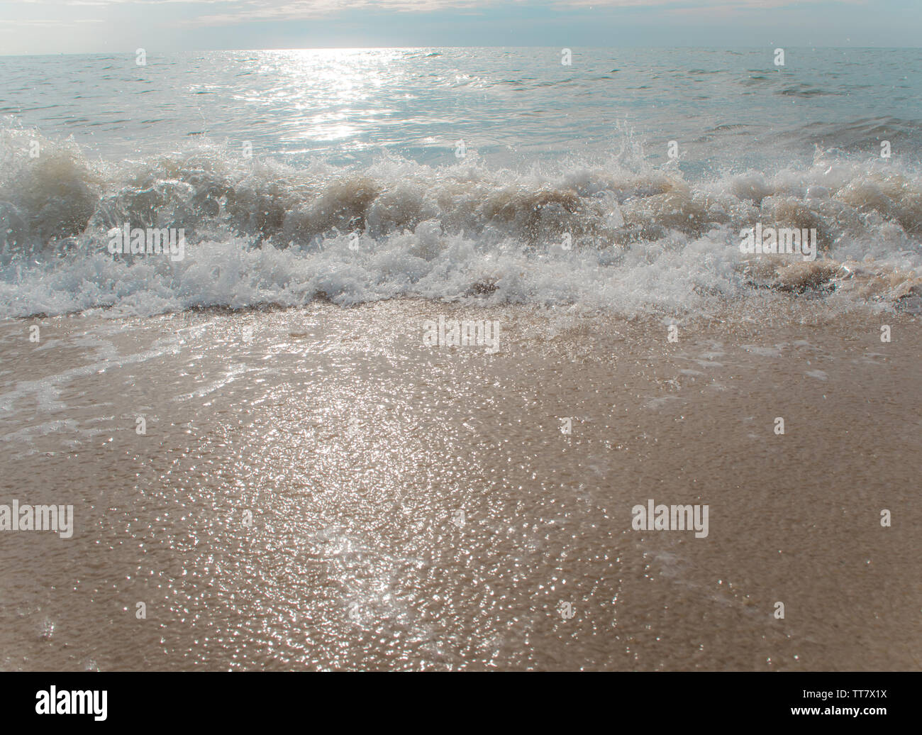 Splash of Sea wave on the beach Stock Photo - Alamy