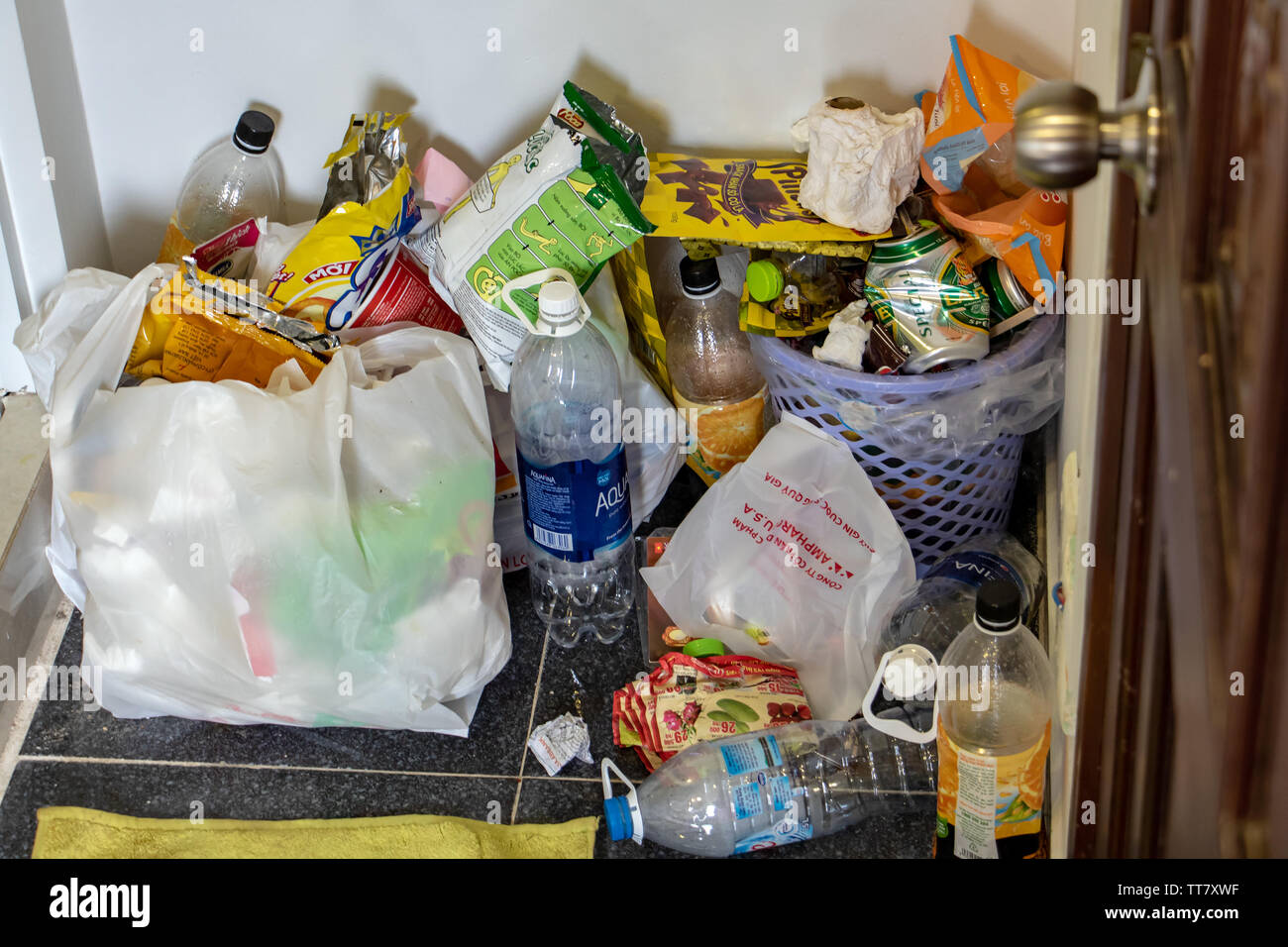 SAIGON, VIETNAM, DEC 18 2017, A lot of rubbish around the waste bin in the hotel room Stock