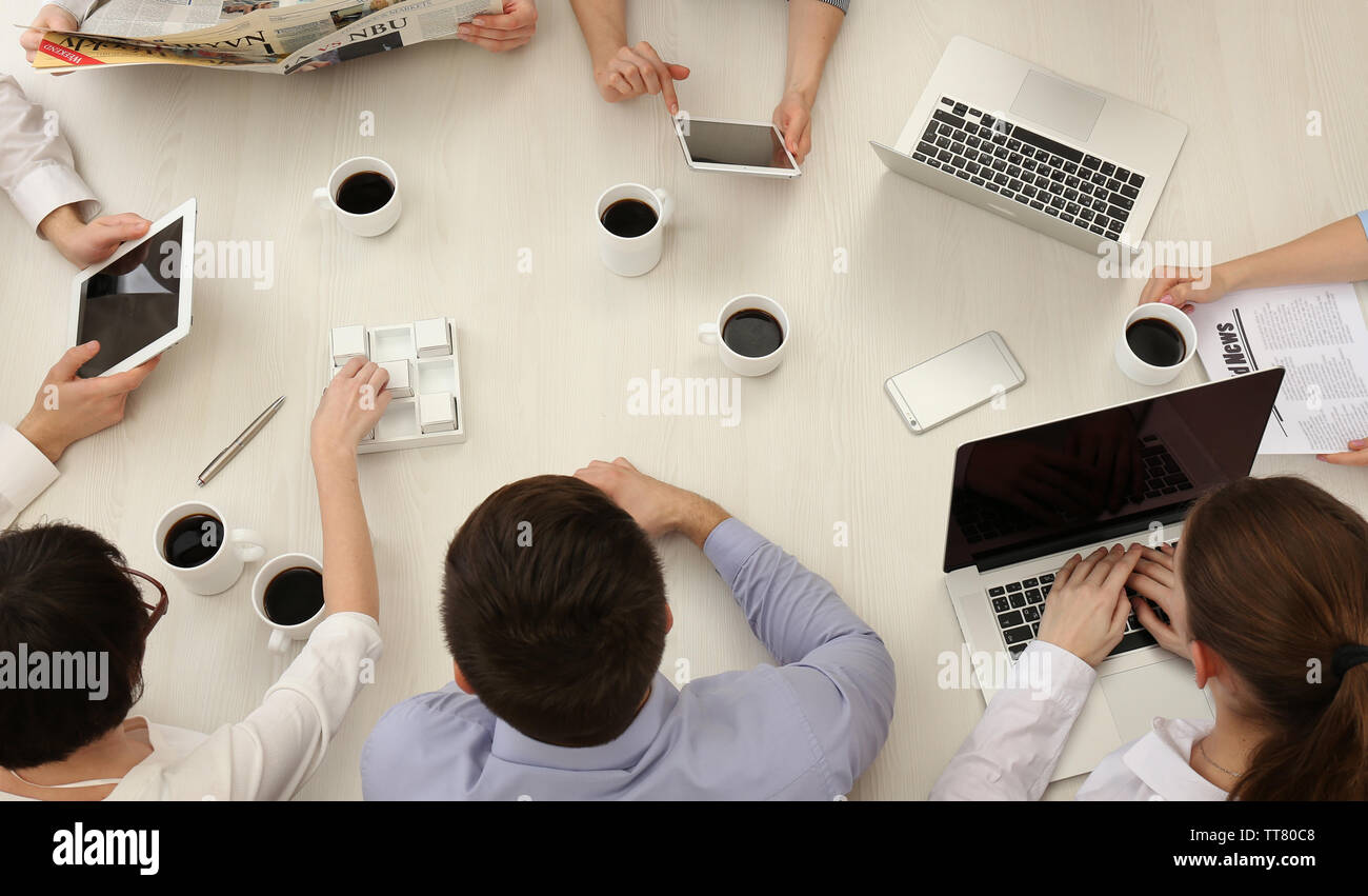 Group of business people working at desk top view Stock Photo - Alamy