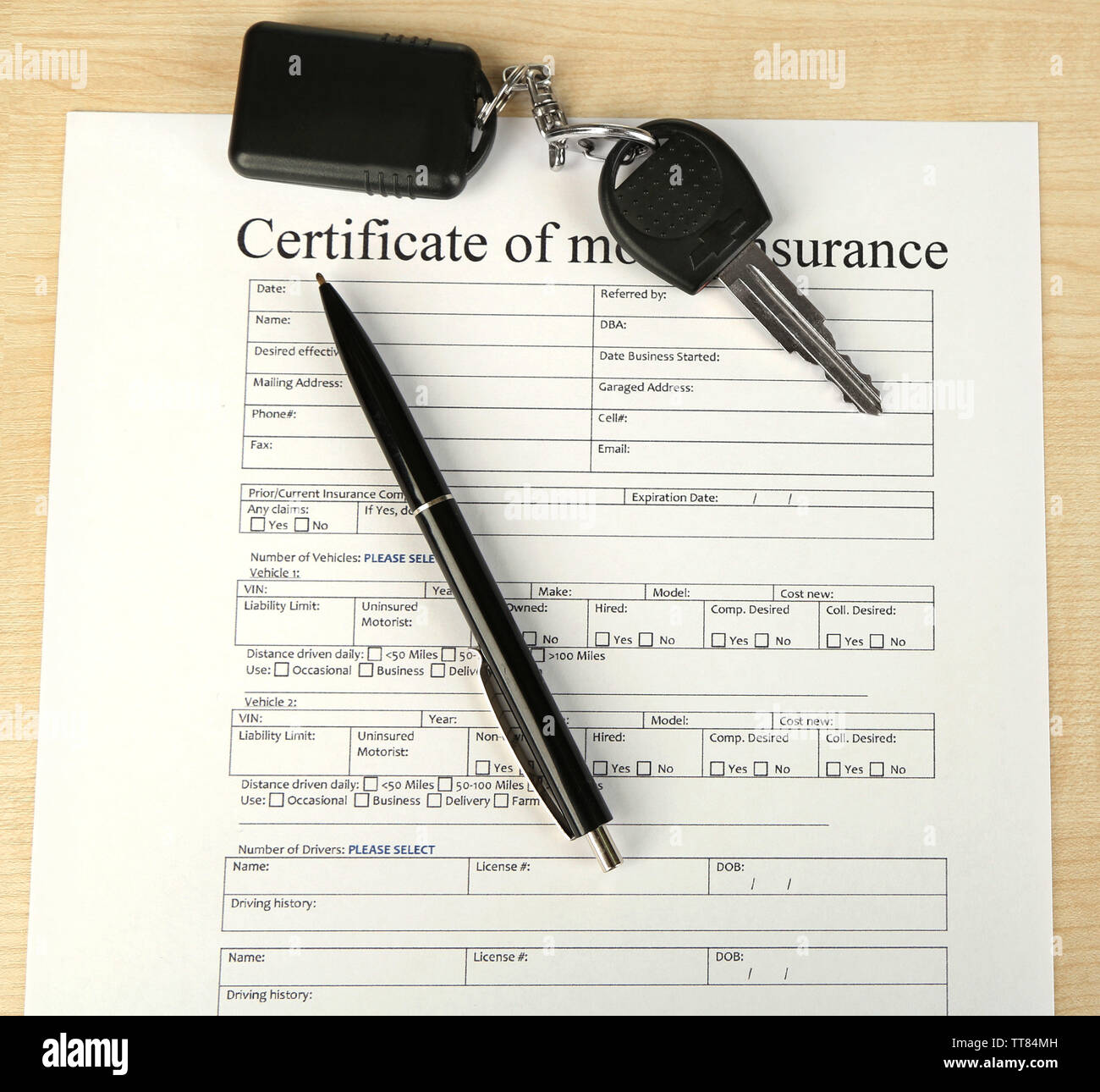 Car keys on insurance documents, close up Stock Photo Alamy