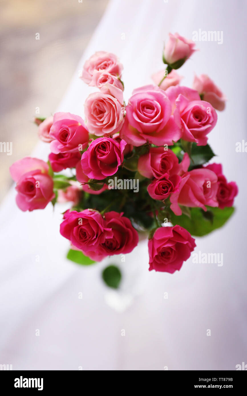 Beautiful pink roses on bright background Stock Photo - Alamy