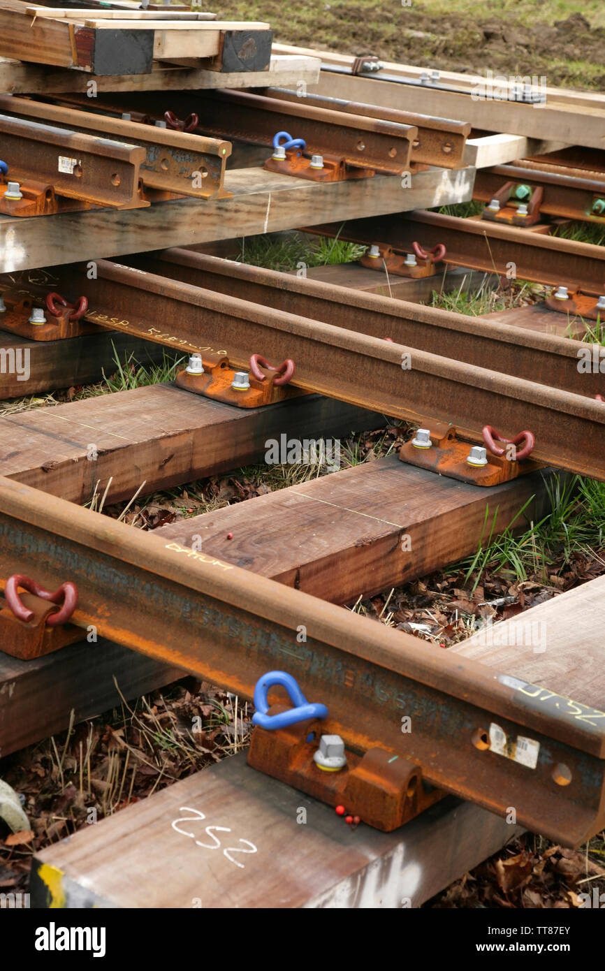 Sections of new rail track awaiting laying Stock Photo Alamy