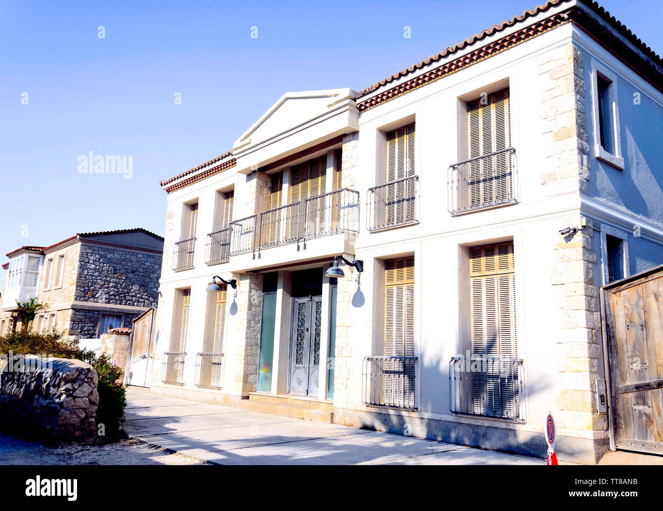 Old Houses view in historical Alacati Town. Alacati is popular tourist destination in Turkey. Stock Photo