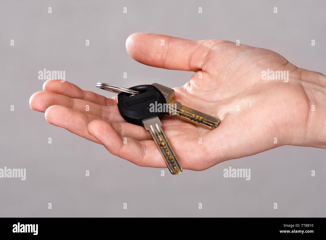 closeup of woman hand holding keys of apartment Stock Photo