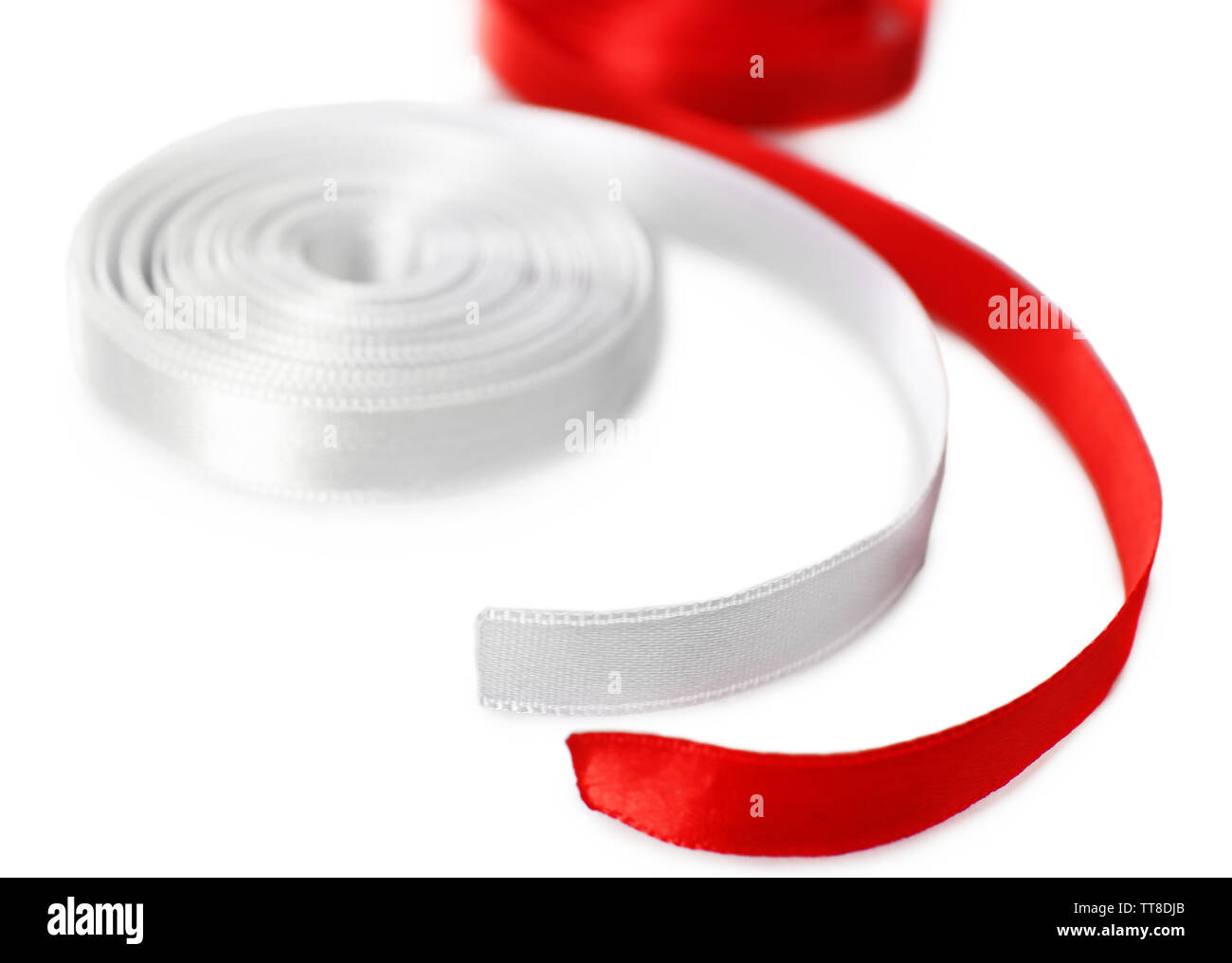 Colorful red and white ribbons isolated on white Stock Photo - Alamy