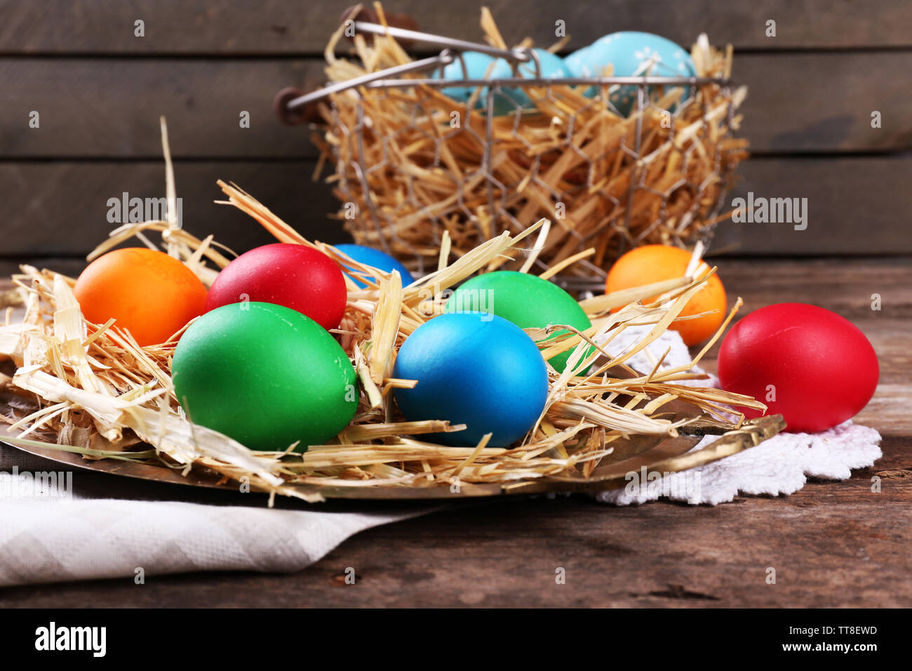 Easter Eggs On Tray With Straw On Vintage Wooden Planks Background